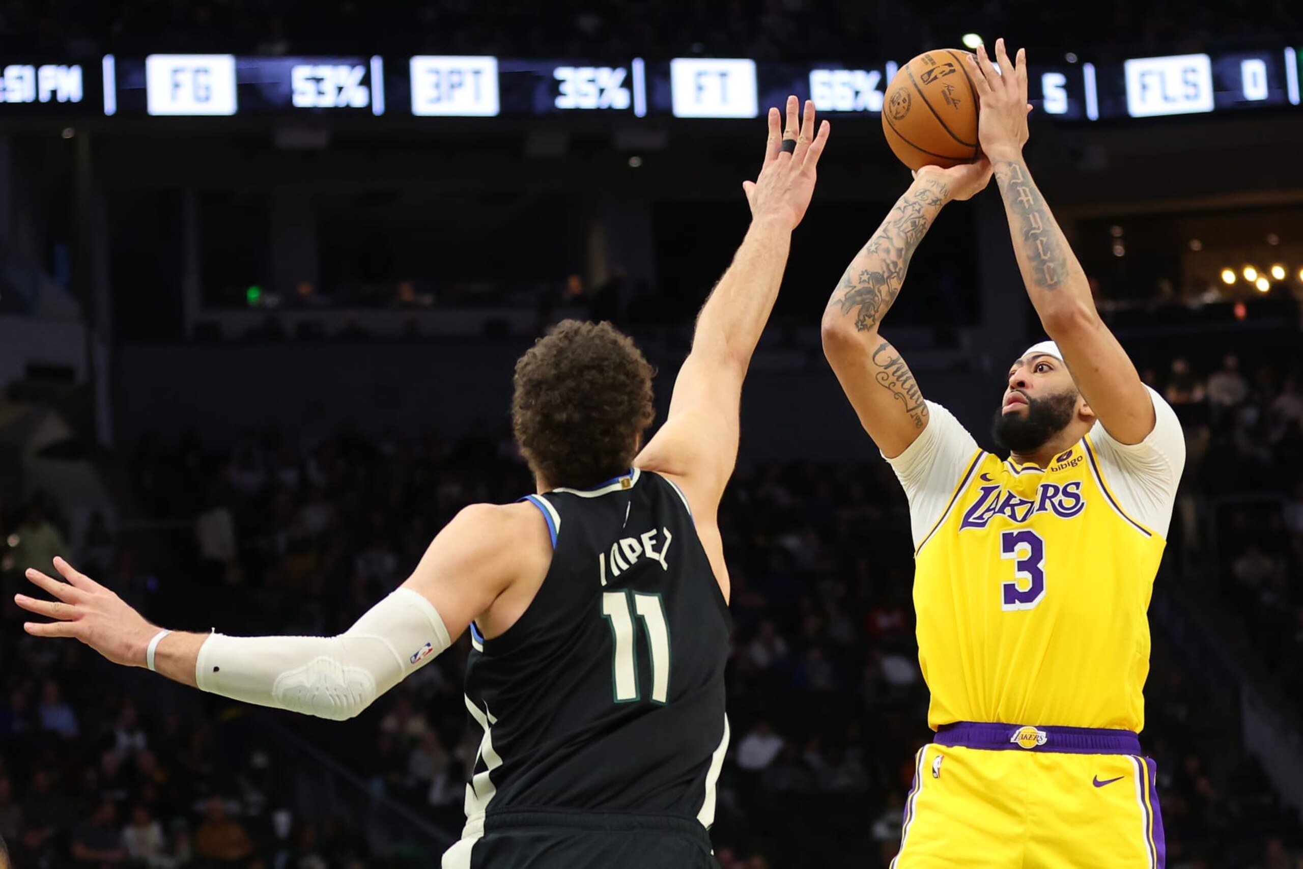 MILWAUKEE, WISCONSIN - MARCH 26: Anthony Davis #3 of the Los Angeles Lakers shoots over Brook Lopez #11 of the Milwaukee Bucks during the second half of a game at Fiserv Forum on March 26, 2024 in Milwaukee, Wisconsin. NOTE TO USER: User expressly acknowledges and agrees that, by downloading and or using this photograph, User is consenting to the terms and conditions of the Getty Images License Agreement. (Photo by Stacy Revere/Getty Images)