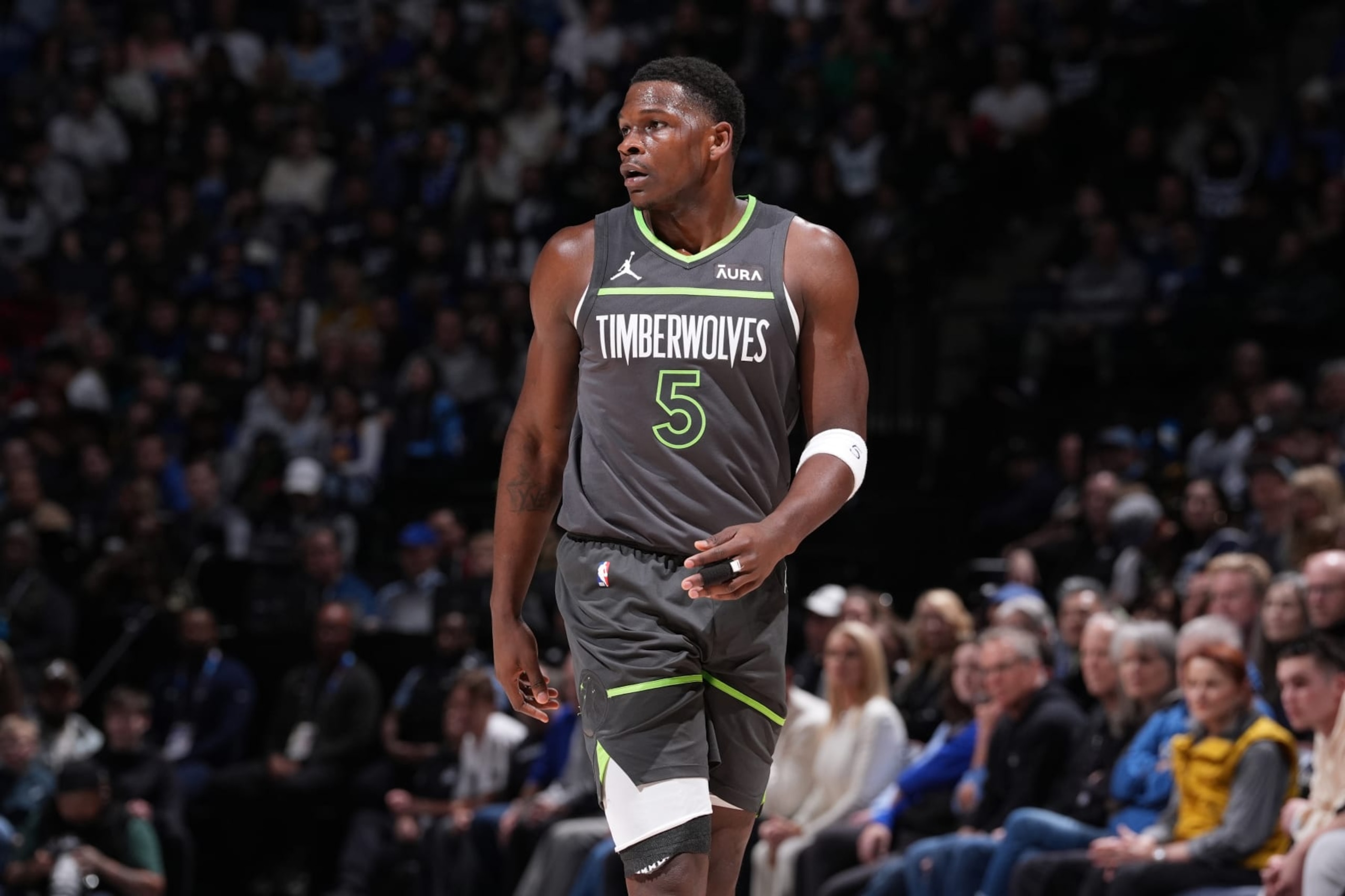 MINNEAPOLIS, MN -  MARCH 24: Anthony Edwards #5 of the Minnesota Timberwolves looks on during the game against the Golden State Warriors on March 24, 2024 at Target Center in Minneapolis, Minnesota. NOTE TO USER: User expressly acknowledges and agrees that, by downloading and or using this Photograph, user is consenting to the terms and conditions of the Getty Images License Agreement. Mandatory Copyright Notice: Copyright 2024 NBAE (Photo by Jordan Johnson/NBAE via Getty Images)