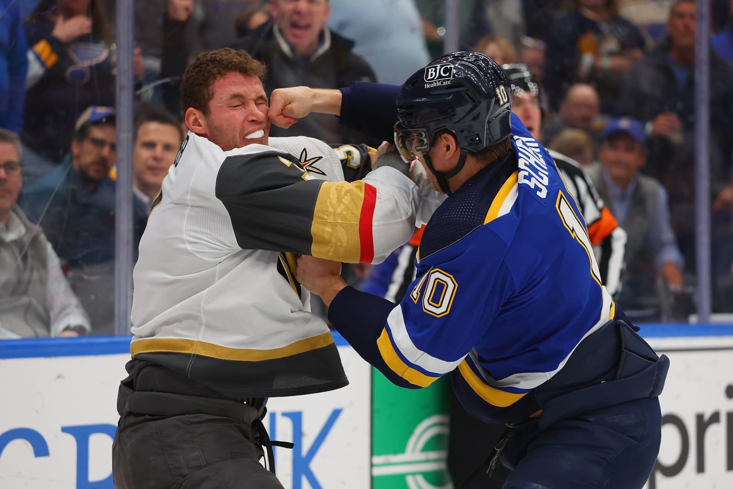 ST LOUIS, MISSOURI - MARCH 25: Brayden Schenn #10 of the St. Louis Blues fights Brayden McNabb #3 of the Vegas Golden Knights during the first period at Enterprise Center on March 25, 2024 in St Louis, Missouri. (Photo by Dilip Vishwanat/Getty Images)