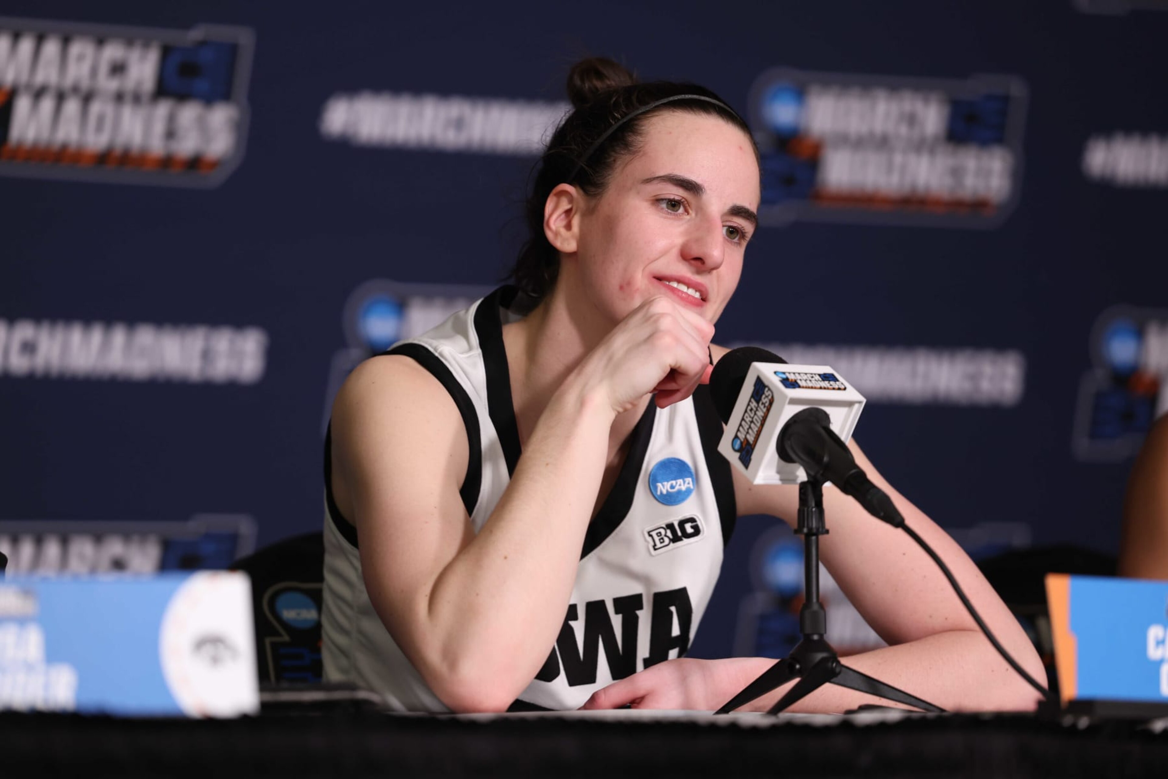 IOWA CITY, IOWA - MARCH 25: Caitlin Clark #22 of the Iowa Hawkeyes speaks to media in a press conference after the Hawkeyes beat the West Virginia Mountaneers during the second round of the 2024 NCAA Women's Basketball Tournament held at Carver-Hawkeye Arena on March 25, 2024 in Iowa City, Iowa. (Photo by Rebecca Gratz/NCAA Photos via Getty Images) IOWA CITY, IOWA - MARCH 25: Caitlin Clark #22 of the Iowa Hawkeyes speaks to media in a press conference after the Hawkeyes beat the West Virginia Mountaneers during the second round of the 2024 NCAA Women's Basketball Tournament held at Carver-Hawkeye Arena on March 25, 2024 in Iowa City, Iowa. (Photo by Rebecca Gratz/NCAA Photos via Getty Images)