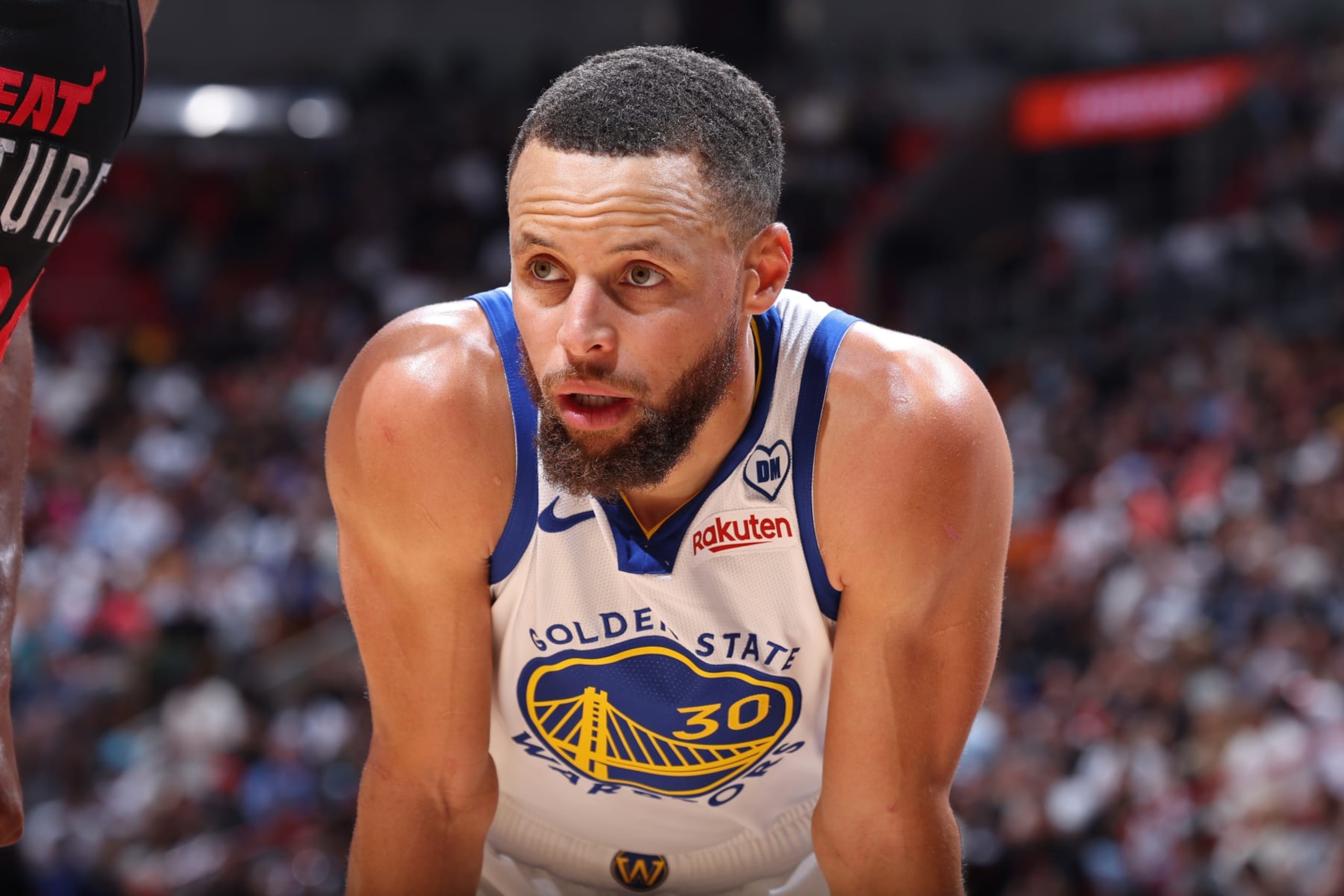 MIAMI, FL - MARCH 26: Stephen Curry #30 of the Golden State Warriors looks on during the game against the Miami Heat   on March 26, 2024 at Kaseya Center in Miami, Florida. NOTE TO USER: User expressly acknowledges and agrees that, by downloading and or using this Photograph, user is consenting to the terms and conditions of the Getty Images License Agreement. Mandatory Copyright Notice: Copyright 2024 NBAE (Photo by Jeff Haynes/NBAE via Getty Images)
