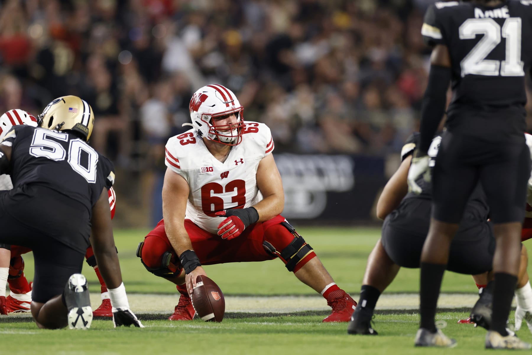 WEST LAFAYETTE, IN - SEPTEMBER 22: Wisconsin Badgers offensive lineman Tanor Bortolini (63) gets set to snap the ball during a college football game against the Purdue Boilermakers on September 22, 2023 at Ross-Ade Stadium in West Lafayette, Indiana. (Photo by Joe Robbins/Icon Sportswire via Getty Images)