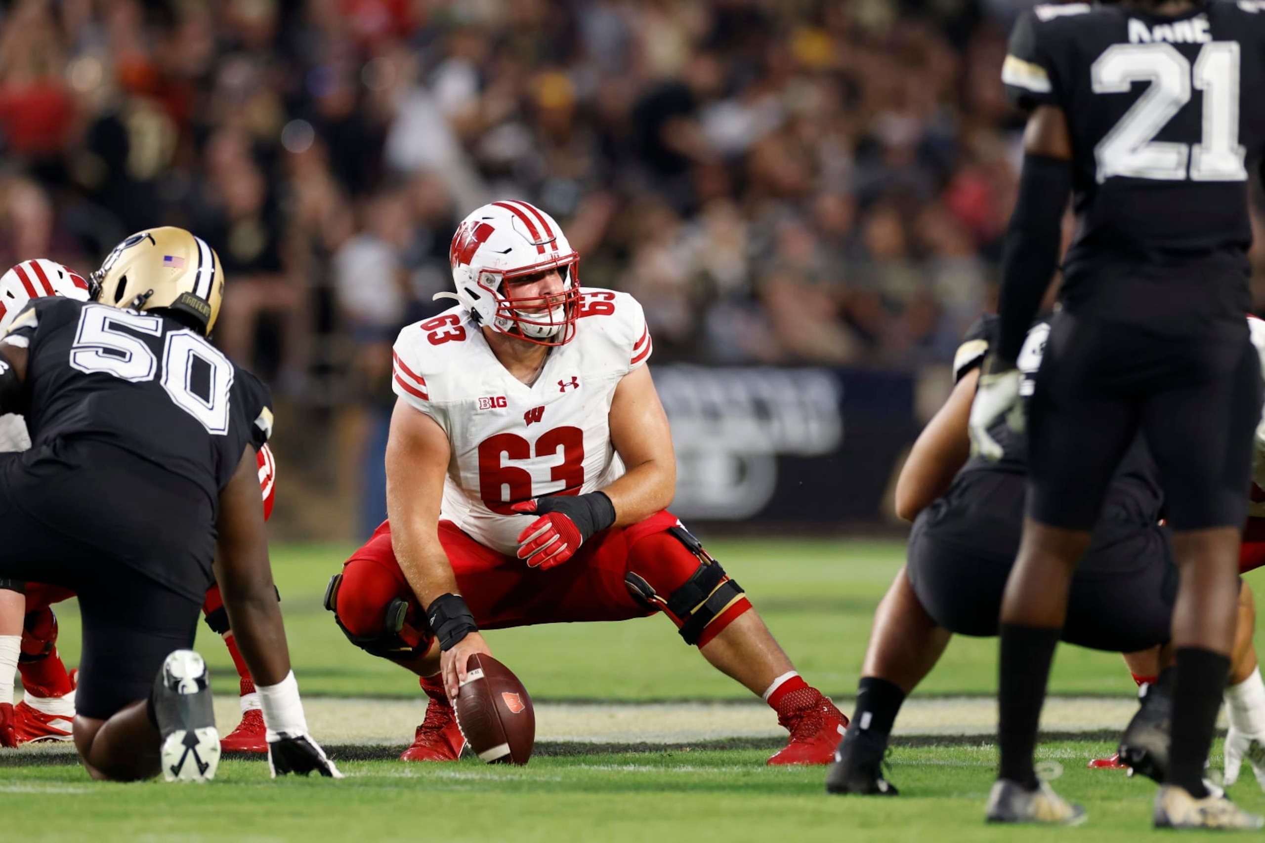 WEST LAFAYETTE, IN - SEPTEMBER 22: Wisconsin Badgers offensive lineman Tanor Bortolini (63) gets set to snap the ball during a college football game against the Purdue Boilermakers on September 22, 2023 at Ross-Ade Stadium in West Lafayette, Indiana. (Photo by Joe Robbins/Icon Sportswire via Getty Images)