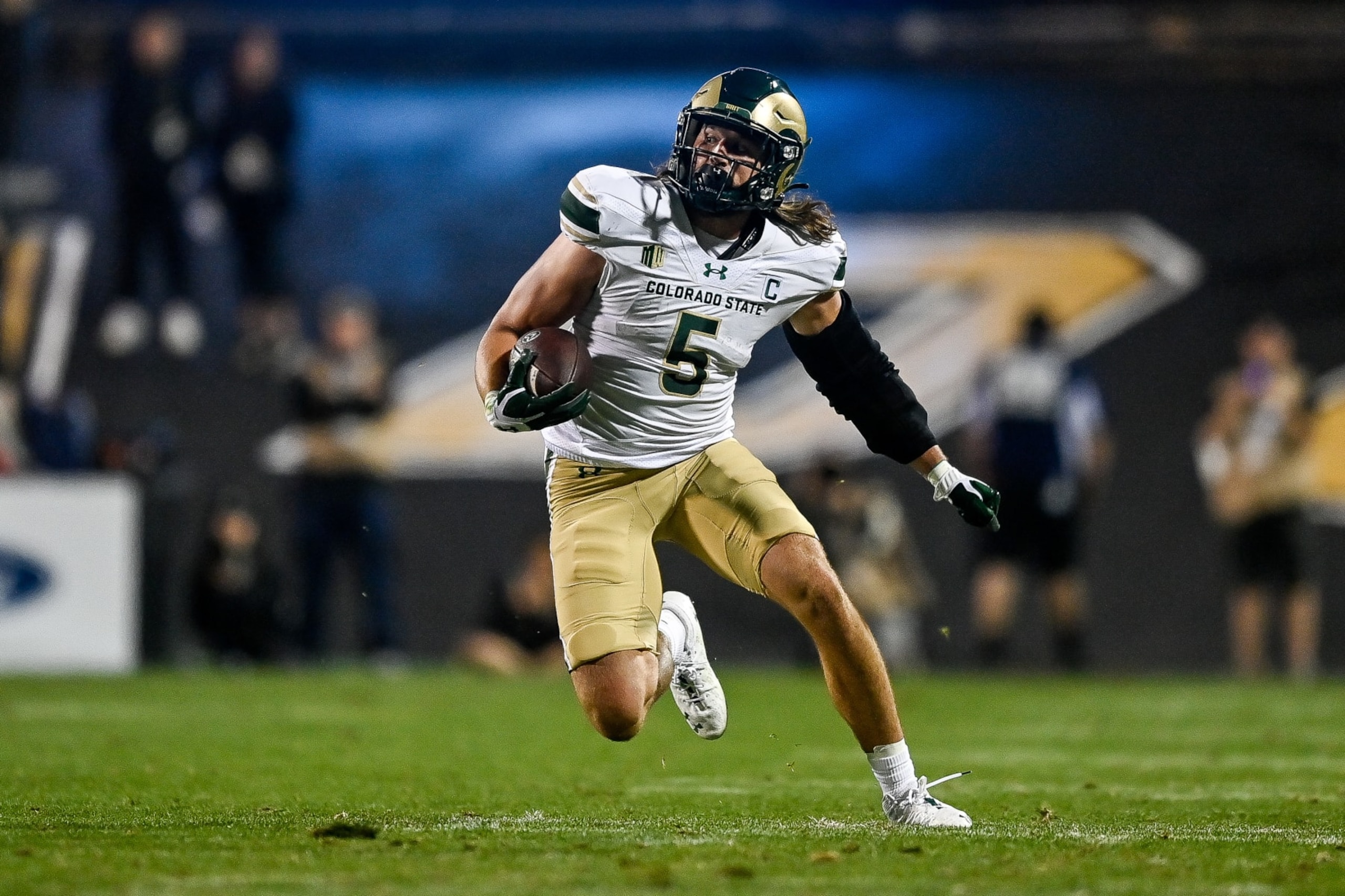 BOULDER, CO - SEPTEMBER 16:  Tight end Dallin Holker #5 of the Colorado State Rams runs after a catch and gains 19 yards and a first down in the third quarter against the Colorado Buffaloes at Folsom Field on September 16, 2023 in Boulder, Colorado. (Photo by Dustin Bradford/Getty Images)