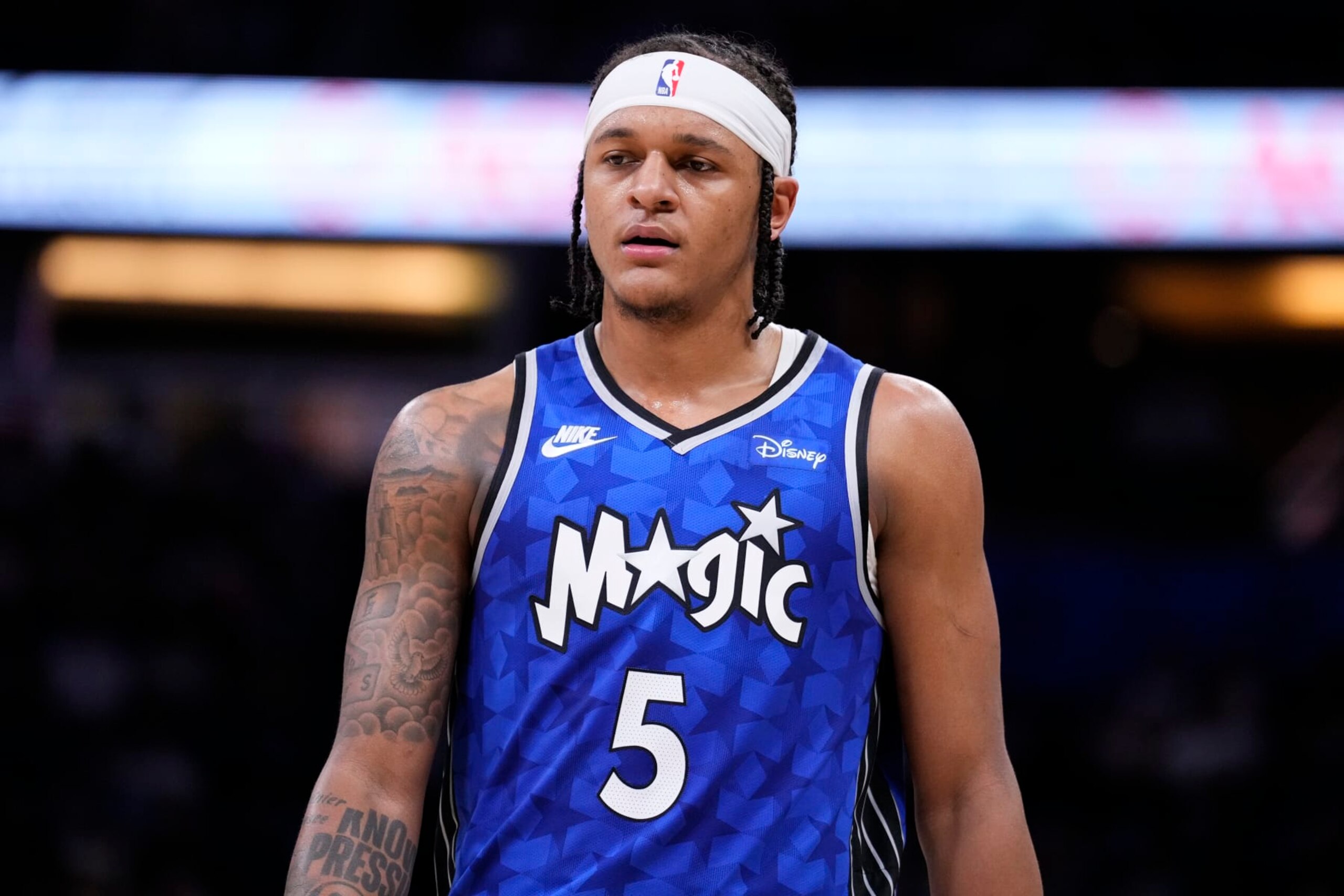 ORLANDO, FLORIDA - MARCH 23: Paolo Banchero #5 of the Orlando Magic looks on against the Sacramento Kings during the third quarter at Kia Center on March 23, 2024 in Orlando, Florida. NOTE TO USER: User expressly acknowledges and agrees that, by downloading and or using this photograph, User is consenting to the terms and conditions of the Getty Images License Agreement. (Photo by Rich Storry/Getty Images)