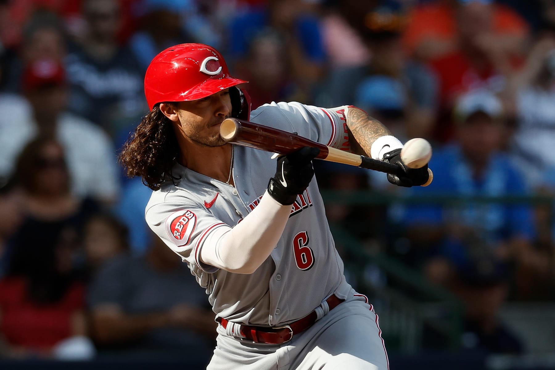 MILWAUKEE, WISCONSIN - JULY 08: Jonathan India #6 of the Cincinnati Reds attempts to bunt during the game against the Milwaukee Brewers at American Family Field on July 08, 2023 in Milwaukee, Wisconsin. (Photo by John Fisher/Getty Images)