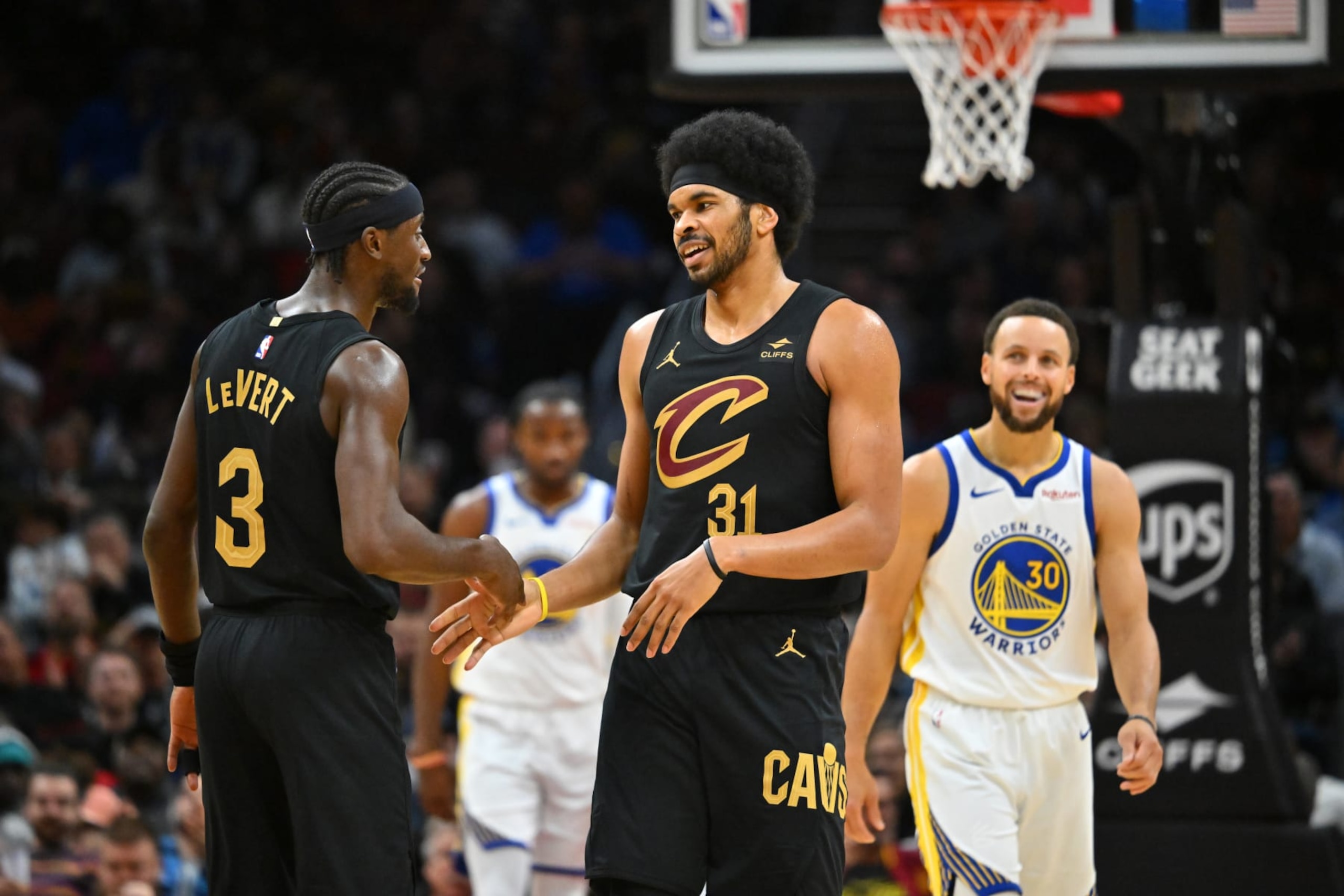 CLEVELAND, OHIO - NOVEMBER 05: Caris LeVert #3 celebrates with Jarrett Allen #31 of the Cleveland Cavaliers during the fourth quarter against the Golden State Warriors at Rocket Mortgage Fieldhouse on November 05, 2023 in Cleveland, Ohio. The Cavaliers defeated the Warriors 115-104. NOTE TO USER: User expressly acknowledges and agrees that, by downloading and or using this photograph, User is consenting to the terms and conditions of the Getty Images License Agreement. (Photo by Jason Miller/Getty Images)