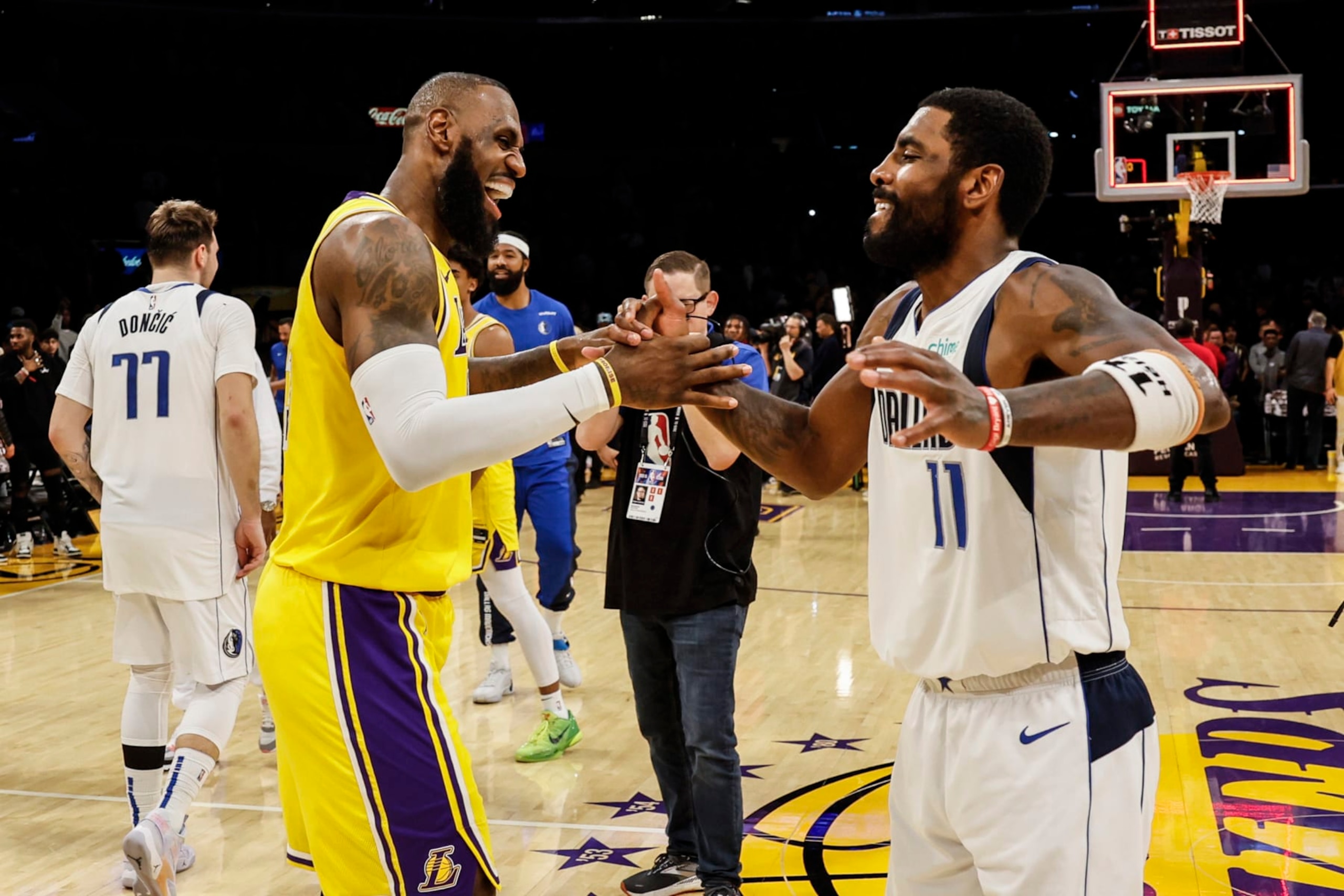 Los Angeles, CA, Wednesday, November 22, 2023 - Los Angeles Lakers forward LeBron James (23) and Dallas Mavericks guard Kyrie Irving (11) embrace at midcourt after the Mavericks beat the Lakers 104-101 at Crypto.Com Arena.  (Robert Gauthier/Los Angeles Times via Getty Images)