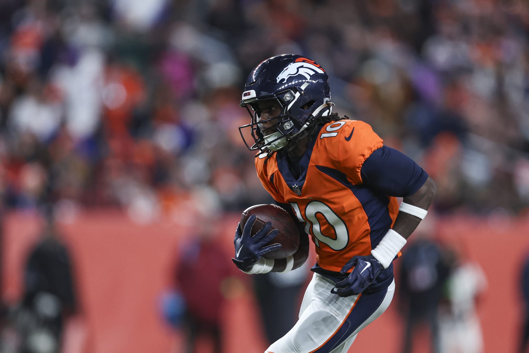 DENVER, CO - DECEMBER 31: Jerry Jeudy #10 of the Denver Broncos runs the ball during an NFL football game against the Los Angeles Chargers at Empower Field at Mile High on December 31, 2023 in Denver, Colorado. (Photo by Perry Knotts/Getty Images)