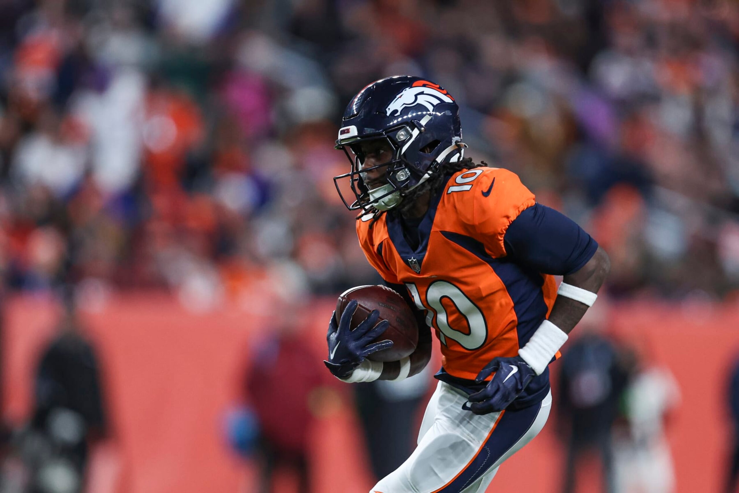 DENVER, CO - DECEMBER 31: Jerry Jeudy #10 of the Denver Broncos runs the ball during an NFL football game against the Los Angeles Chargers at Empower Field at Mile High on December 31, 2023 in Denver, Colorado. (Photo by Perry Knotts/Getty Images)