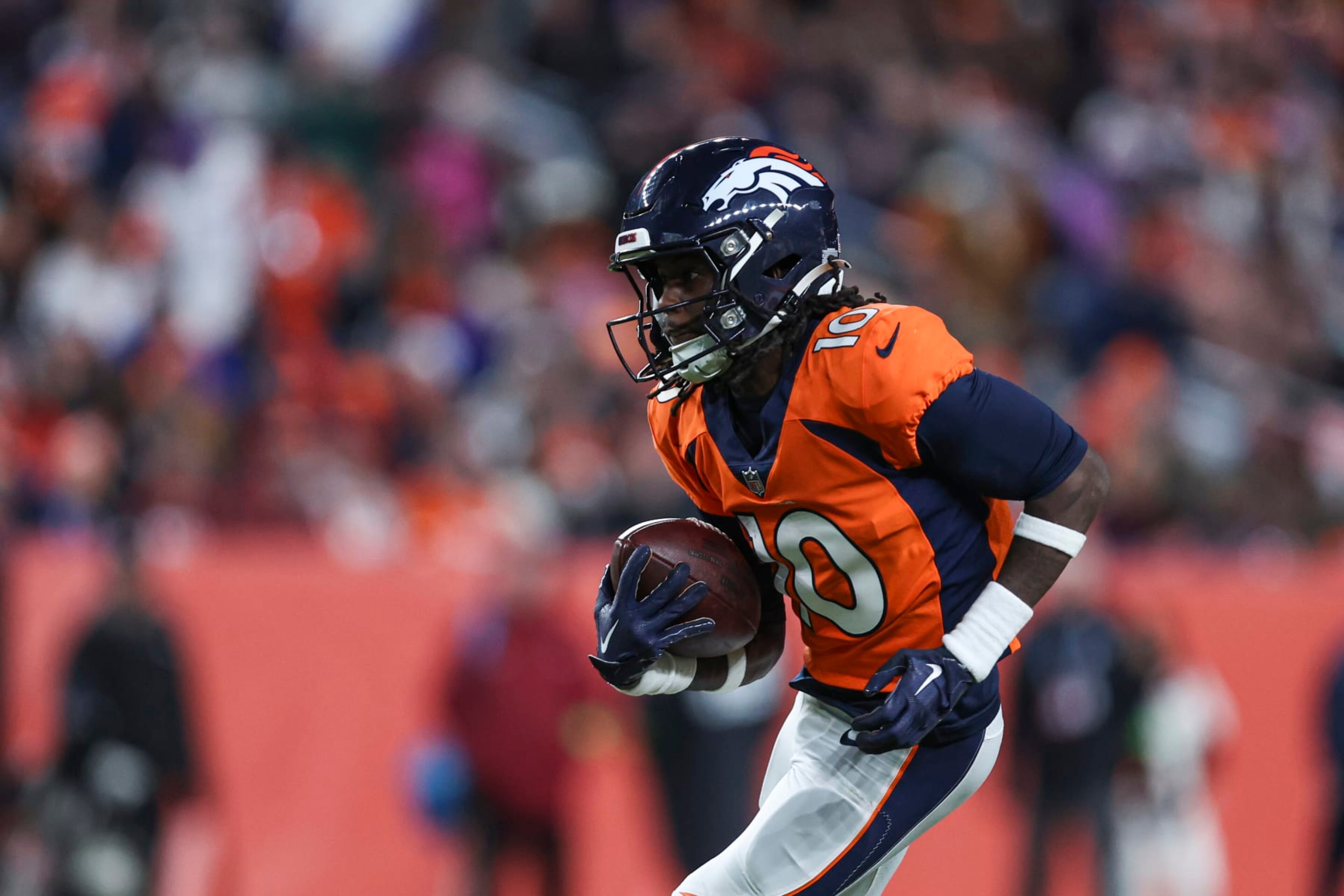 DENVER, CO - DECEMBER 31: Jerry Jeudy #10 of the Denver Broncos runs the ball during an NFL football game against the Los Angeles Chargers at Empower Field at Mile High on December 31, 2023 in Denver, Colorado. (Photo by Perry Knotts/Getty Images)