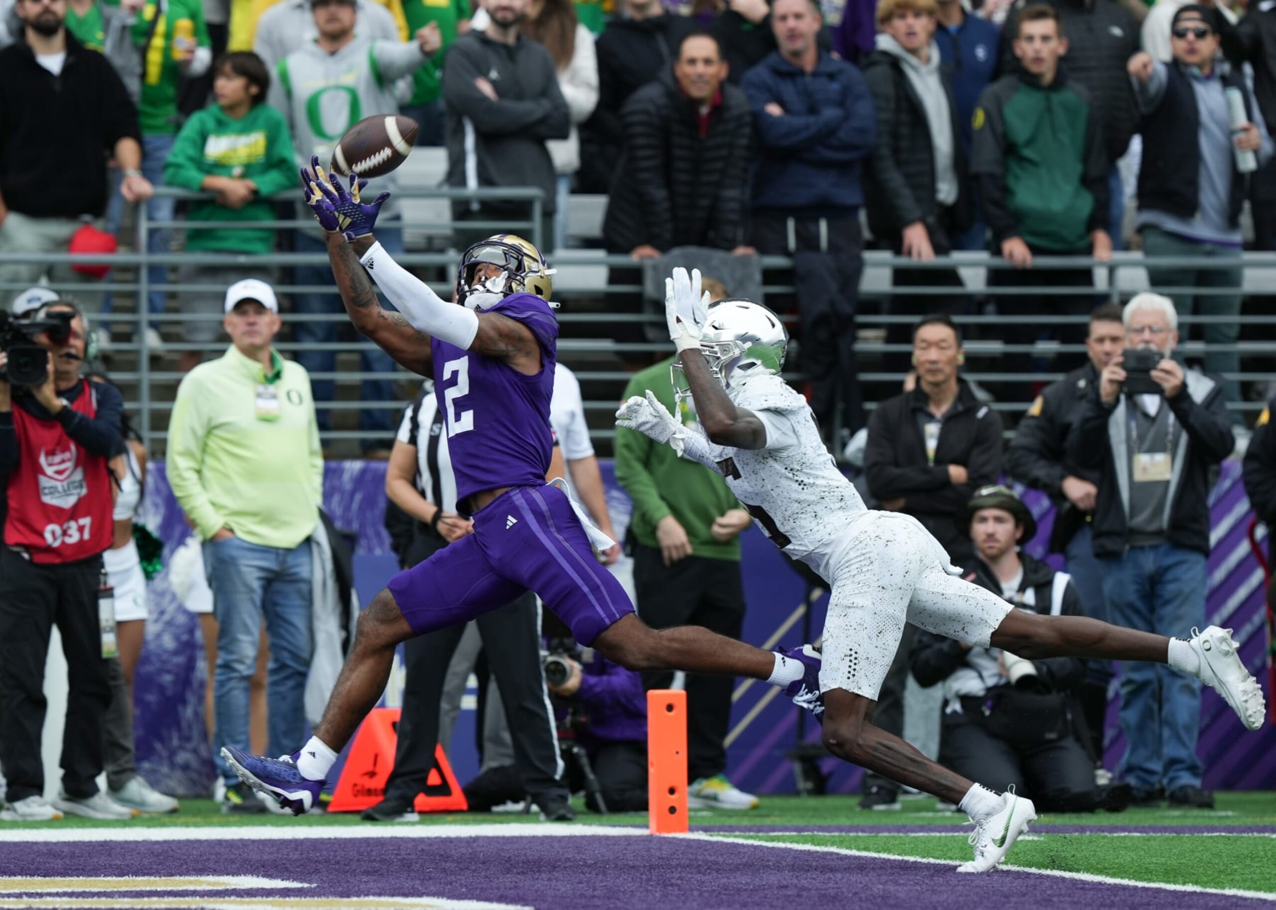 SEATTLE, WA - OCTOBER 14: Washington Huskies wide receiver Ja'Lynn Polk (2) makes a big catch against Oregon Ducks defensive back Khyree Jackson (5) for a Washington touchdown during a PAC12 football game between the Oregon Ducks and Washington Huskies on October 14, 2023 at Husky Stadium in Seattle, WA. (Photo by Jeff Halstead/Icon Sportswire via Getty Images)