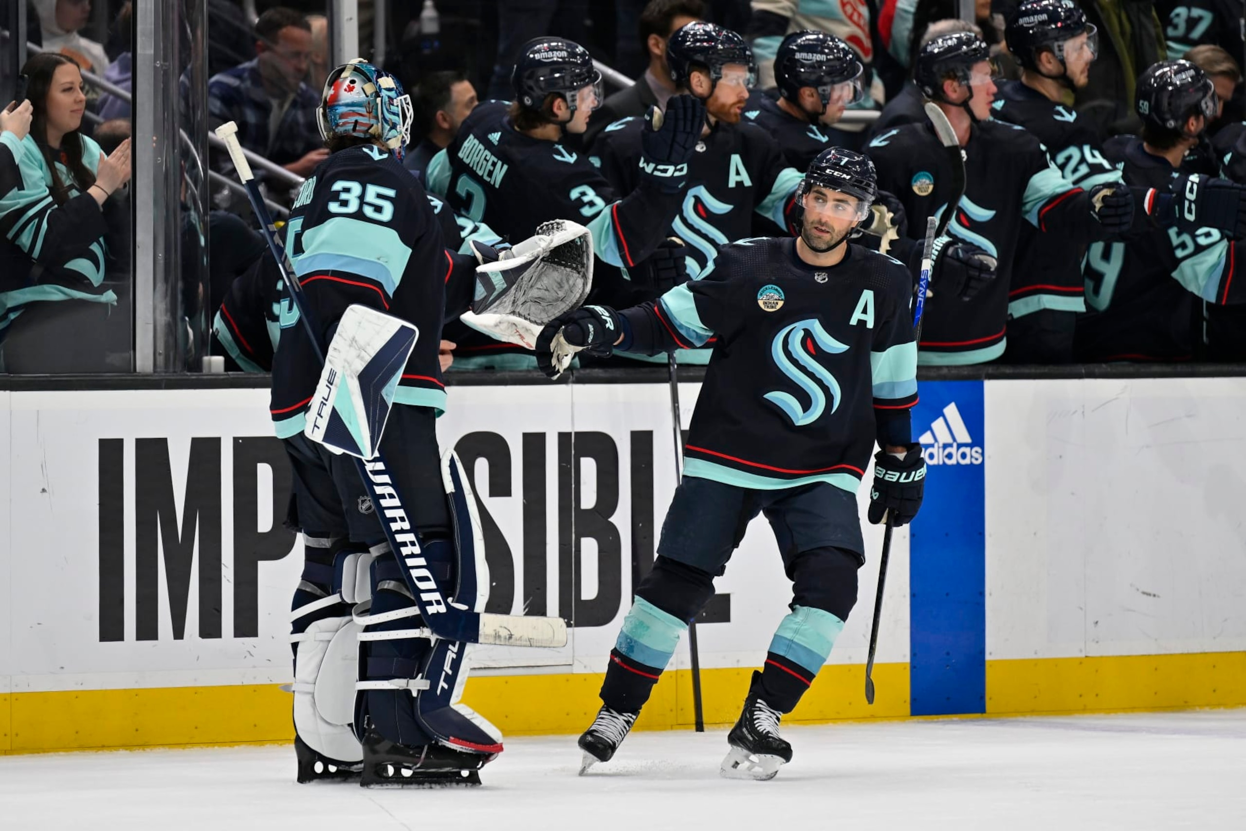 SEATTLE, WASHINGTON - MARCH 26: Jordan Eberle #7 of the Seattle Kraken celebrates with Joey Daccord #35 after scoring during the first period against the Anaheim Ducks at Climate Pledge Arena on March 26, 2024 in Seattle, Washington. (Photo by Alika Jenner/Getty Images)