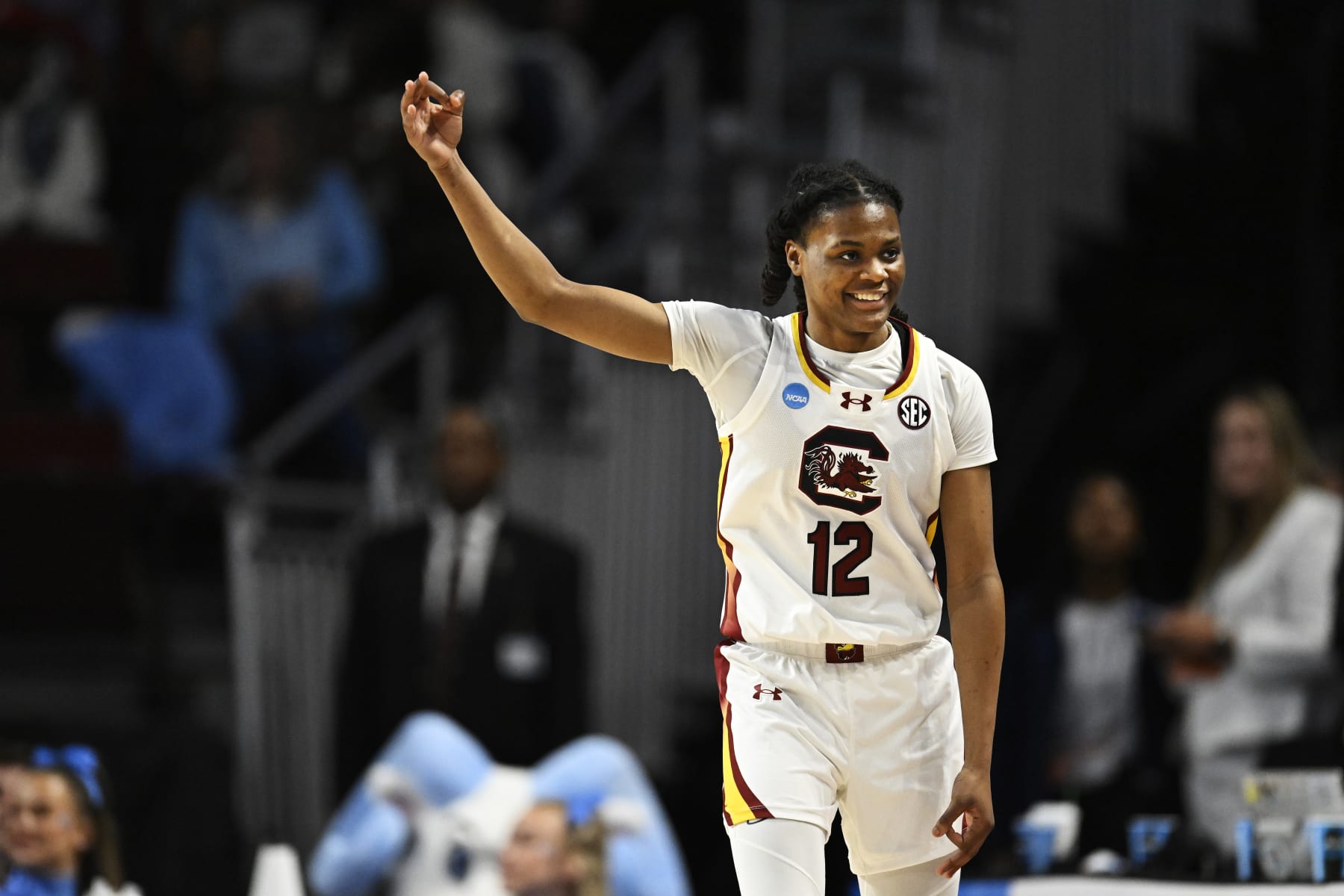 COLUMBIA, SOUTH CAROLINA - MARCH 24: MiLaysia Fulwiley #12 of the South Carolina Gamecocks celebrates her three point basket against the North Carolina Tar Heels in the second quarter during the second round of the NCAA Women’s Basketball Tournament at Colonial Life Arena on March 24, 2024 in Columbia, South Carolina. (Photo by Eakin Howard/Getty Images)