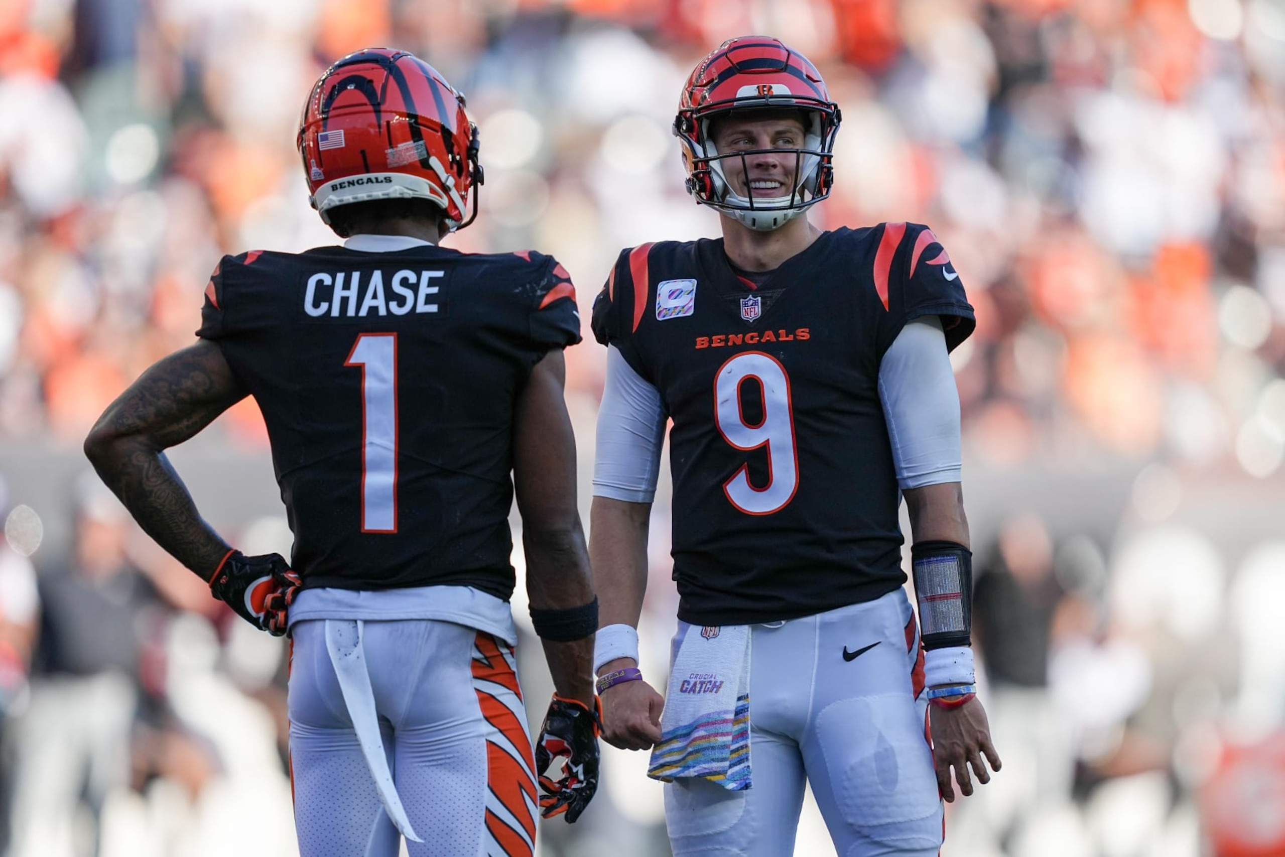 CINCINNATI, OHIO - OCTOBER 23: Ja'Marr Chase #1 and Joe Burrow #9 of the Cincinnati Bengals meet in the fourth quarter against the Atlanta Falcons at Paycor Stadium on October 23, 2022 in Cincinnati, Ohio. (Photo by Dylan Buell/Getty Images) CINCINNATI, OHIO - OCTOBER 23: Ja'Marr Chase #1 and Joe Burrow #9 of the Cincinnati Bengals meet in the fourth quarter against the Atlanta Falcons at Paycor Stadium on October 23, 2022 in Cincinnati, Ohio. (Photo by Dylan Buell/Getty Images)