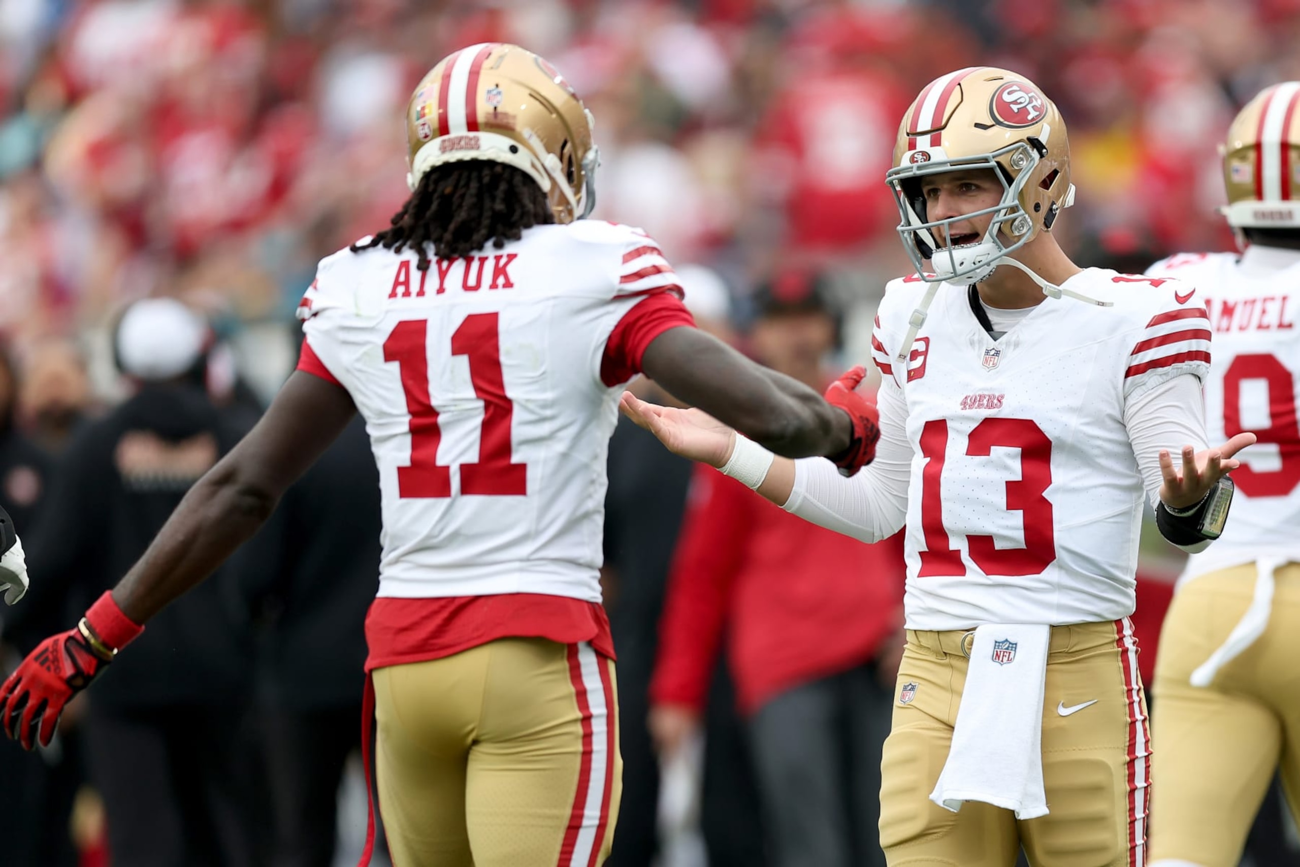 JACKSONVILLE, FLORIDA - NOVEMBER 12: Brock Purdy #13 of the San Francisco 49ers celebrates a touchdown with Brandon Aiyuk #11 of the San Francisco 49ers during the first quarter at EverBank Stadium on November 12, 2023 in Jacksonville, Florida. (Photo by Mike Carlson/Getty Images) JACKSONVILLE, FLORIDA - NOVEMBER 12: Brock Purdy #13 of the San Francisco 49ers celebrates a touchdown with Brandon Aiyuk #11 of the San Francisco 49ers during the first quarter at EverBank Stadium on November 12, 2023 in Jacksonville, Florida. (Photo by Mike Carlson/Getty Images)