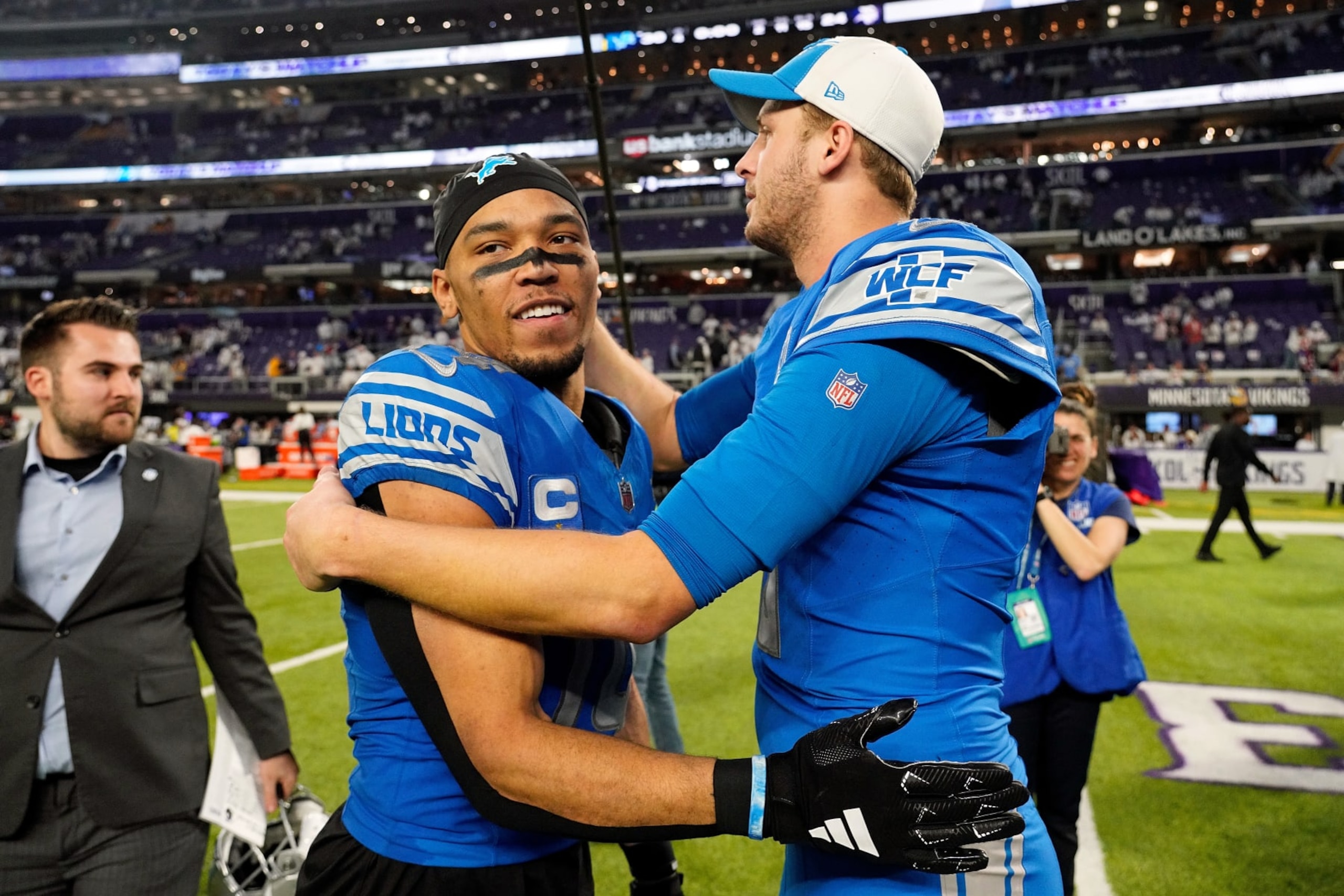 MINNEAPOLIS, MINNESOTA - DECEMBER 24: Amon-Ra St. Brown #14 and Jared Goff #16 of the Detroit Lions celebrate their victory after the game against the Minnesota Vikings at U.S. Bank Stadium on December 24, 2023 in Minneapolis, Minnesota. The Lions defeated the Vikings 30-24. (Photo by David Berding/Getty Images) MINNEAPOLIS, MINNESOTA - DECEMBER 24: Amon-Ra St. Brown #14 and Jared Goff #16 of the Detroit Lions celebrate their victory after the game against the Minnesota Vikings at U.S. Bank Stadium on December 24, 2023 in Minneapolis, Minnesota. The Lions defeated the Vikings 30-24. (Photo by David Berding/Getty Images)