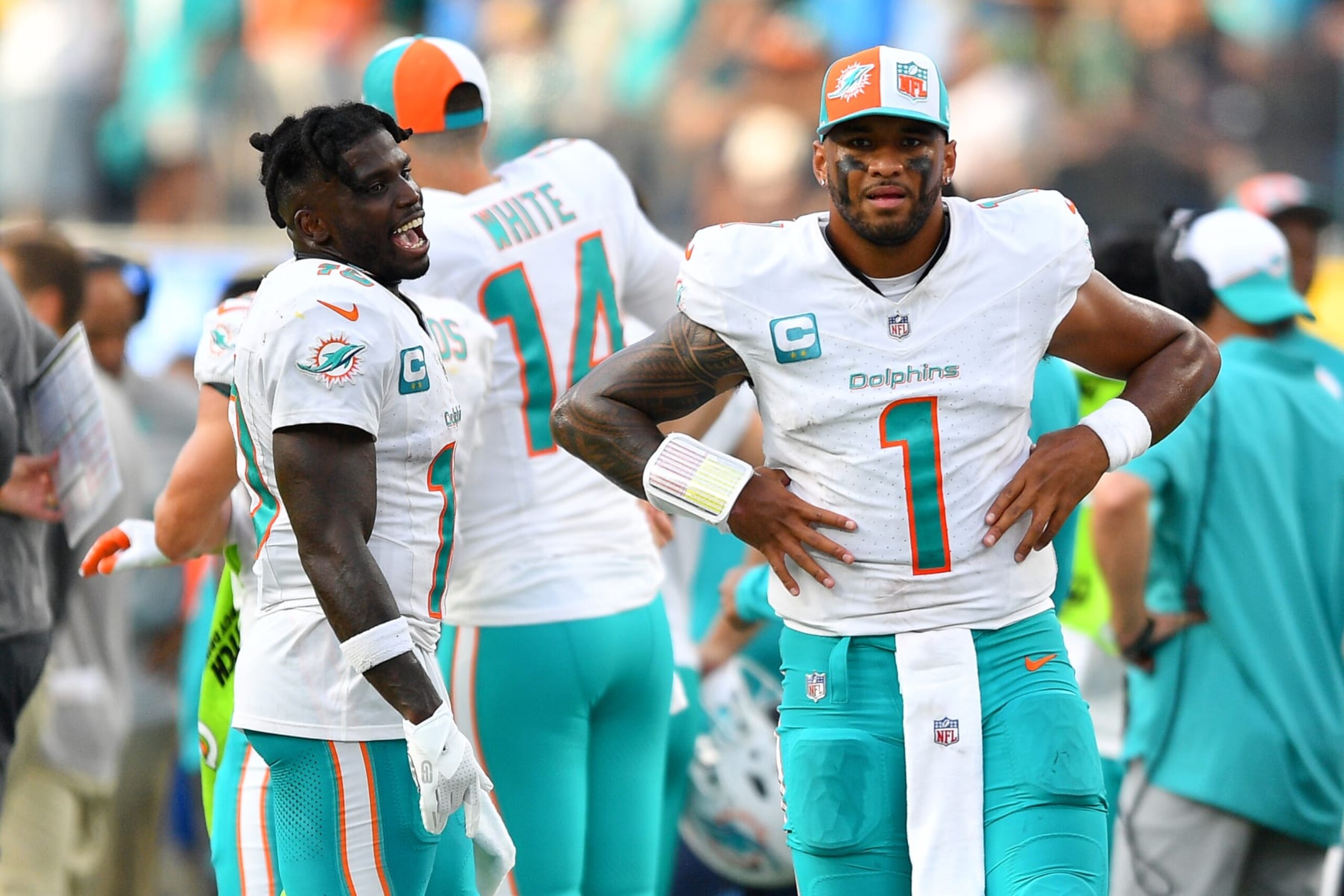 INGLEWOOD, CA - SEPTEMBER 10: Miami Dolphins wide receiver Tyreek Hill (10) and Miami Dolphins quarterback Tua Tagovailoa (1) look on during the NFL regular season game between the Miami Dolphins and the Los Angeles Chargers on September 10, 2023, at SoFi Stadium in Inglewood, CA. (Photo by Brian Rothmuller/Icon Sportswire via Getty Images) INGLEWOOD, CA - SEPTEMBER 10: Miami Dolphins wide receiver Tyreek Hill (10) and Miami Dolphins quarterback Tua Tagovailoa (1) look on during the NFL regular season game between the Miami Dolphins and the Los Angeles Chargers on September 10, 2023, at SoFi Stadium in Inglewood, CA. (Photo by Brian Rothmuller/Icon Sportswire via Getty Images)