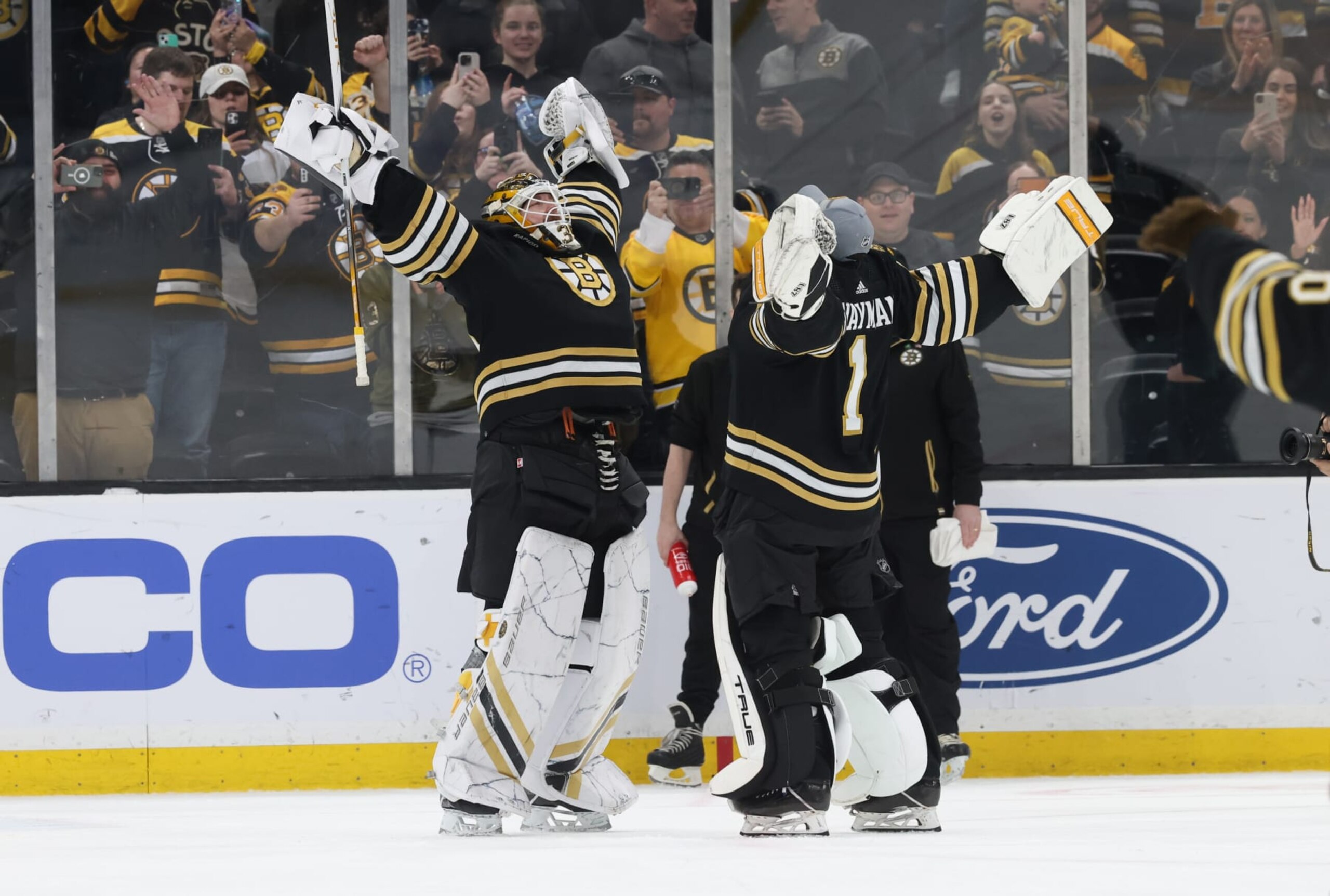 BOSTON, MASSACHUSETTS - MARCH 19: Linus Ullmark #35 of the Boston Bruins celebrates a 6-2 win against the Ottawa Senators with teammate Jeremy Swayman #1 at the TD Garden on March 19, 2024 in Boston, Massachusetts. (Photo by Richard T Gagnon/Getty Images) BOSTON, MASSACHUSETTS - MARCH 19: Linus Ullmark #35 of the Boston Bruins celebrates a 6-2 win against the Ottawa Senators with teammate Jeremy Swayman #1 at the TD Garden on March 19, 2024 in Boston, Massachusetts. (Photo by Richard T Gagnon/Getty Images)