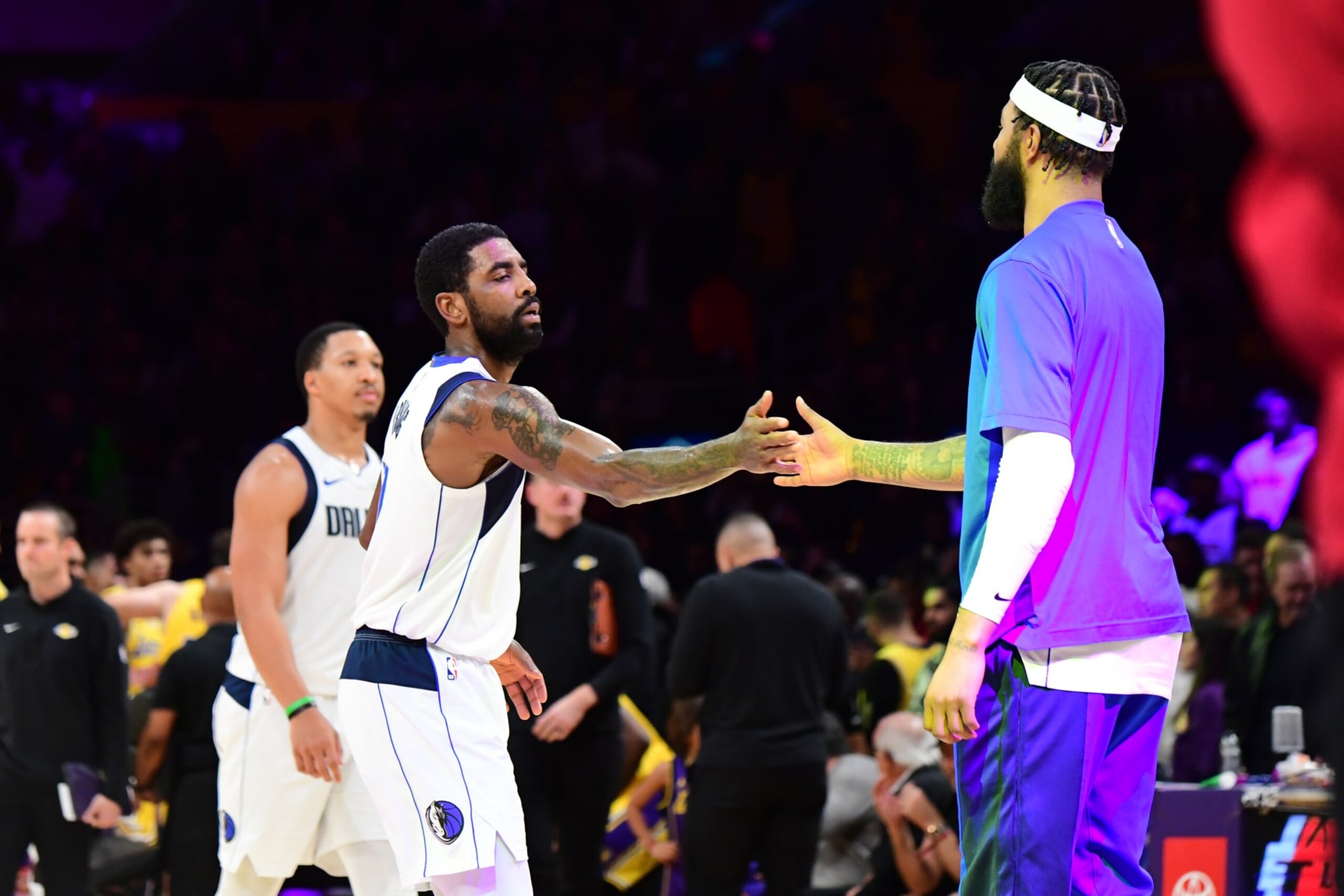 LOS ANGELES, CA - NOVEMBER 22: Kyrie Irving #11 of the Dallas Mavericks high fives Anthony Davis #3 of the Los Angeles Lakers during the game on November 22, 2023 at Crypto.Com Arena in Los Angeles, California. NOTE TO USER: User expressly acknowledges and agrees that, by downloading and/or using this Photograph, user is consenting to the terms and conditions of the Getty Images License Agreement. Mandatory Copyright Notice: Copyright 2023 NBAE (Photo by Adam Pantozzi/NBAE via Getty Images)