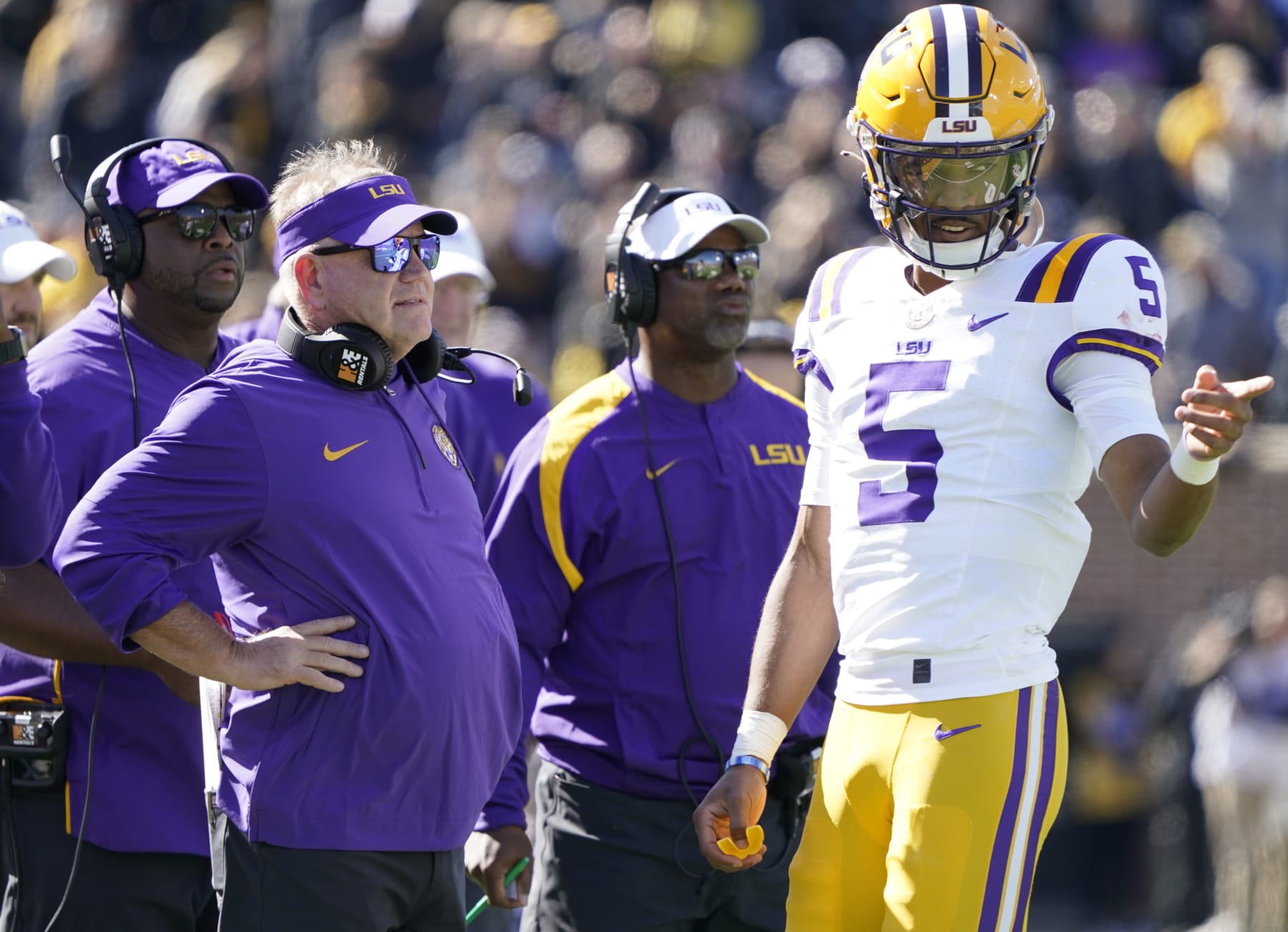 COLUMBIA, MISSOURI - OCTOBER 07: Quarterback Jayden Daniels #5 of the LSU Tigers talks with head coach Brian Kelly of the LSU Tigers during a time out against the Missouri Tigers in the first half at Faurot Field/Memorial Stadium on October 07, 2023 in Columbia, Missouri. (Photo by Ed Zurga/Getty Images)
