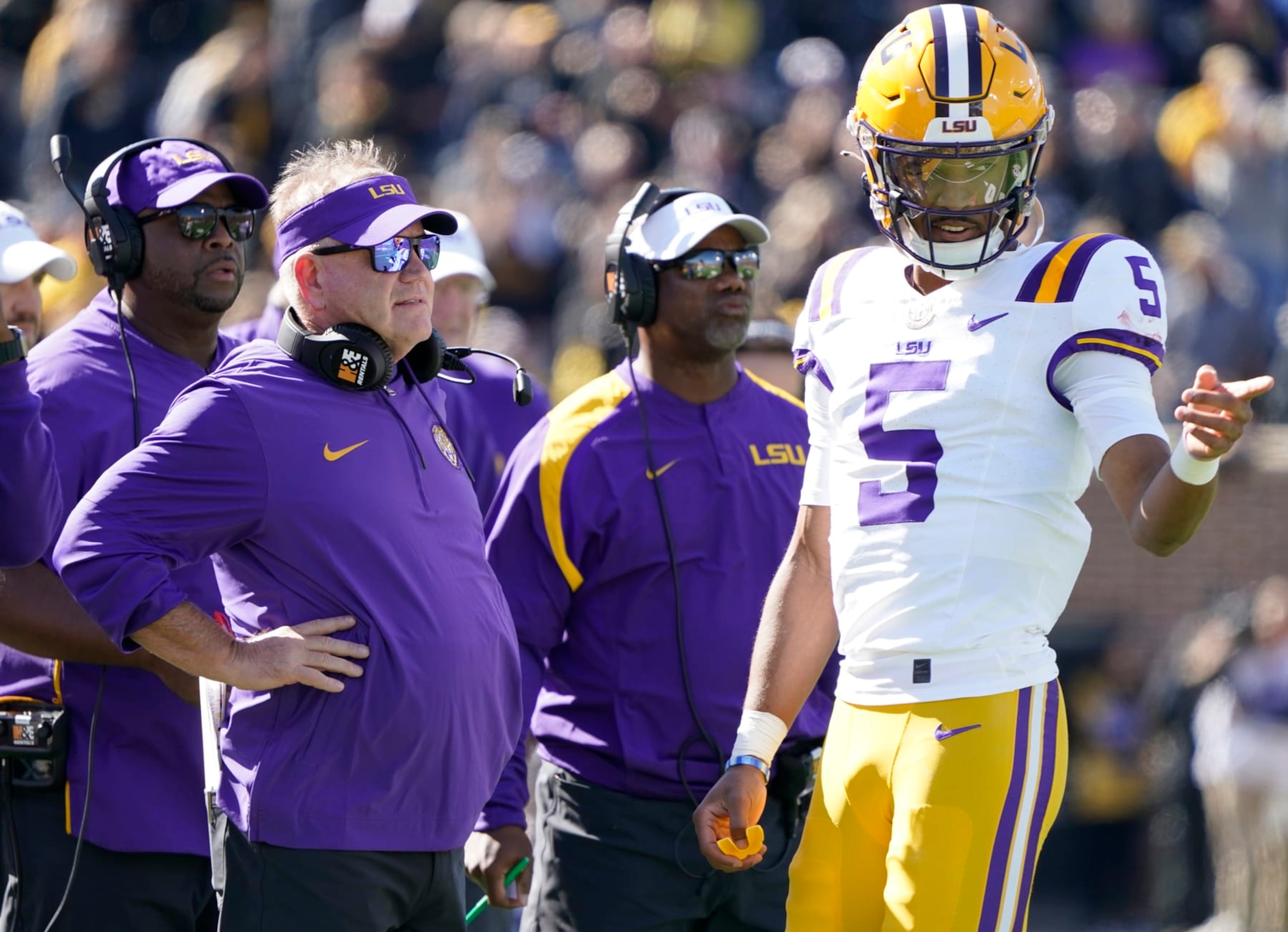 COLUMBIA, MISSOURI - OCTOBER 07: Quarterback Jayden Daniels #5 of the LSU Tigers talks with head coach Brian Kelly of the LSU Tigers during a time out against the Missouri Tigers in the first half at Faurot Field/Memorial Stadium on October 07, 2023 in Columbia, Missouri. (Photo by Ed Zurga/Getty Images)