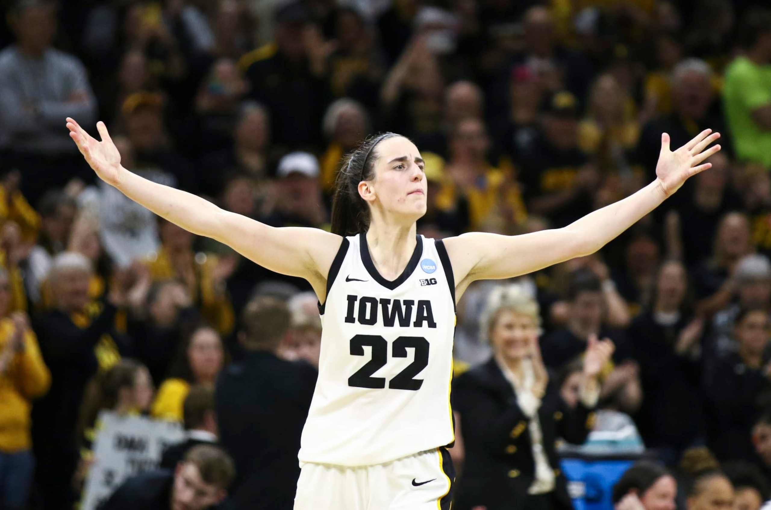 IOWA CITY, IOWA- MARCH 25:  Guard Caitlin Clark #22 of the Iowa Hawkeyes celebrates after drawing a foul late in the second half against the West Virginia Mountaineers during their second round match-up in the 2024 NCAA Division 1 Womens Basketball Championship at Carver-Hawkeye Arena on March 25, 2024 in Iowa City, Iowa.  (Photo by Matthew Holst/Getty Images)