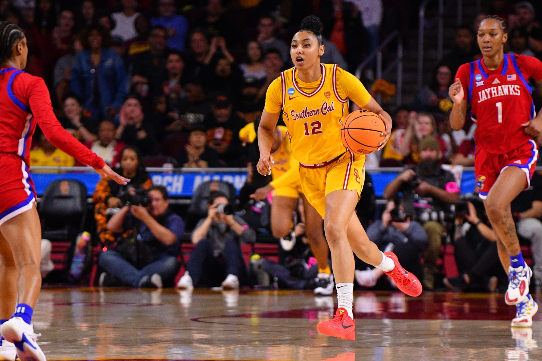 LOS ANGELES, CA - MARCH 25: USC Trojans guard JuJu Watkins (12) dribbles up the court during the Kansas Jayhawks game versus the USC Trojans in the second round of the NCAA Division I Women's Championship on March 25, 2024, at the Galen Center in Los Angeles, CA. (Photo by Brian Rothmuller/Icon Sportswire via Getty Images) LOS ANGELES, CA - MARCH 25: USC Trojans guard JuJu Watkins (12) dribbles up the court during the Kansas Jayhawks game versus the USC Trojans in the second round of the NCAA Division I Women's Championship on March 25, 2024, at the Galen Center in Los Angeles, CA. (Photo by Brian Rothmuller/Icon Sportswire via Getty Images)