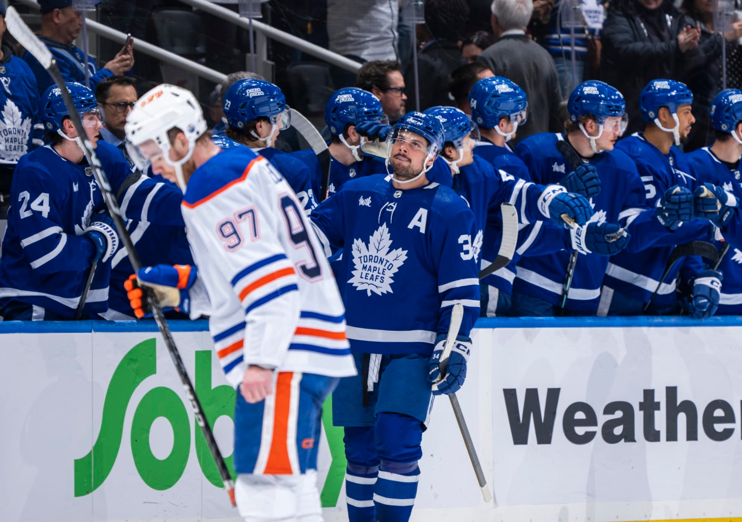 TORONTO, ON - MARCH 23: Auston Matthews #34 of the Toronto Maple Leafs celebrates his goal behidn Connor McDavid #97 of the Edmonton Oilers during the third period at Scotiabank Arena on March 23, 2024 in Toronto, Ontario, Canada. (Photo by Mark Blinch/NHLI via Getty Images)