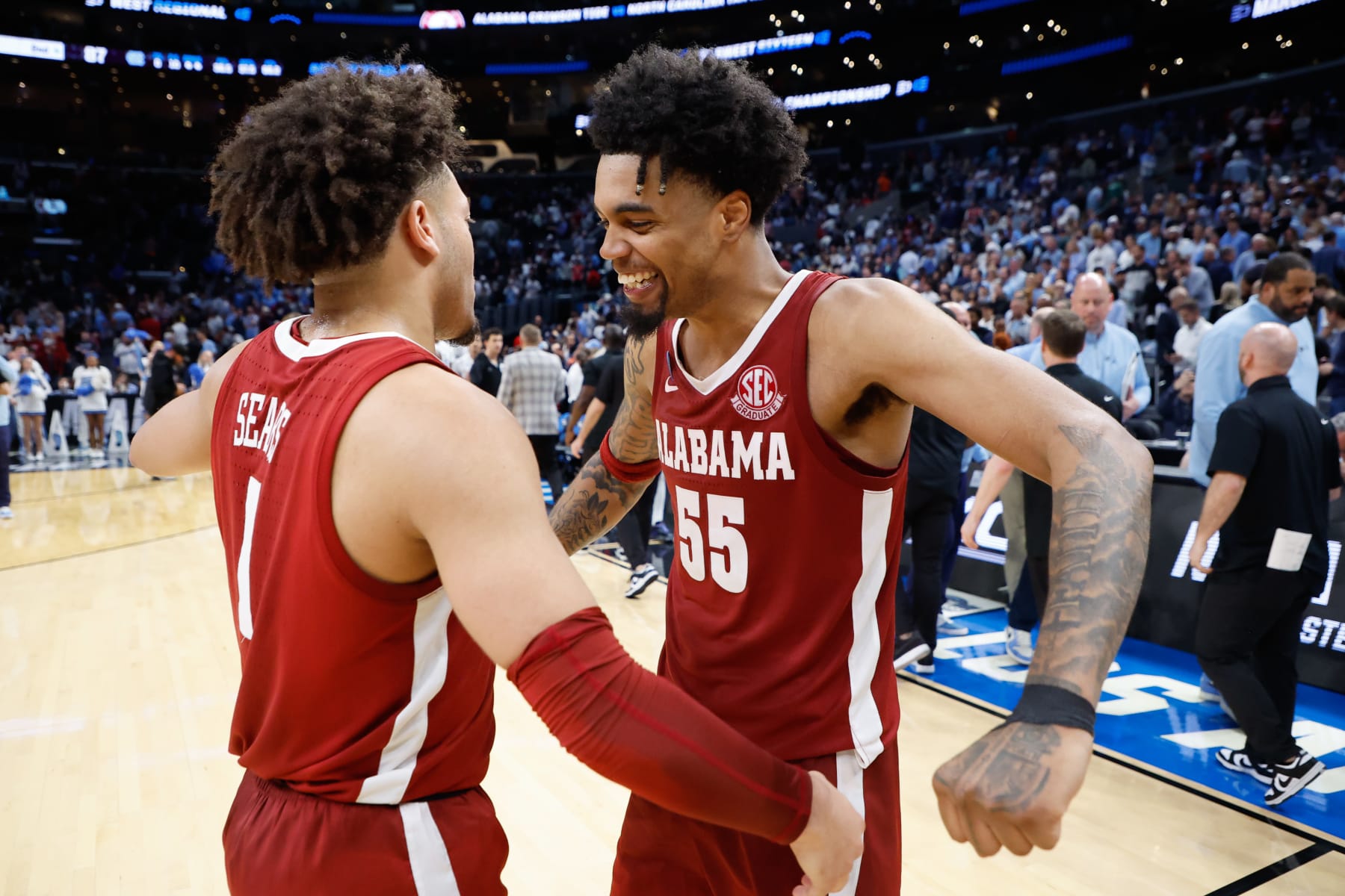 LOS ANGELES, CALIFORNIA - MARCH 28: Mark Sears #1 & Aaron Estrada #55 of the Alabama Crimson Tide celebrate the win against the North Carolina Tar Heels during the Sweet Sixteen round of the 2024 NCAA Men's Basketball Tournament held at Crypto.com Arena on March 28, 2024 in Los Angeles, California. (Photo by C. Morgan Engel/NCAA Photos via Getty Images)