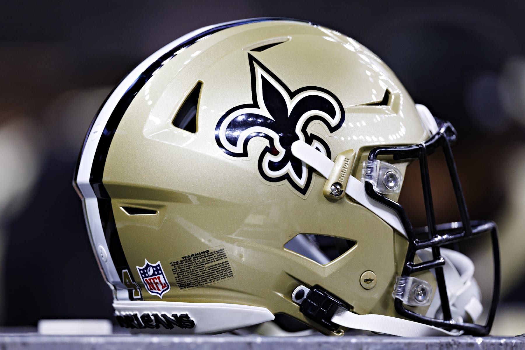 NEW ORLEANS, LOUISIANA - AUGUST 27:  Helmet of the New Orleans Saints on the sidelines during the preseason game against the Houston Texans at Caesars Superdome on August 27, 2023 in New Orleans, Louisiana. The Texans defeated the Saints 17-13.  (Photo by Wesley Hitt/Getty Images)
