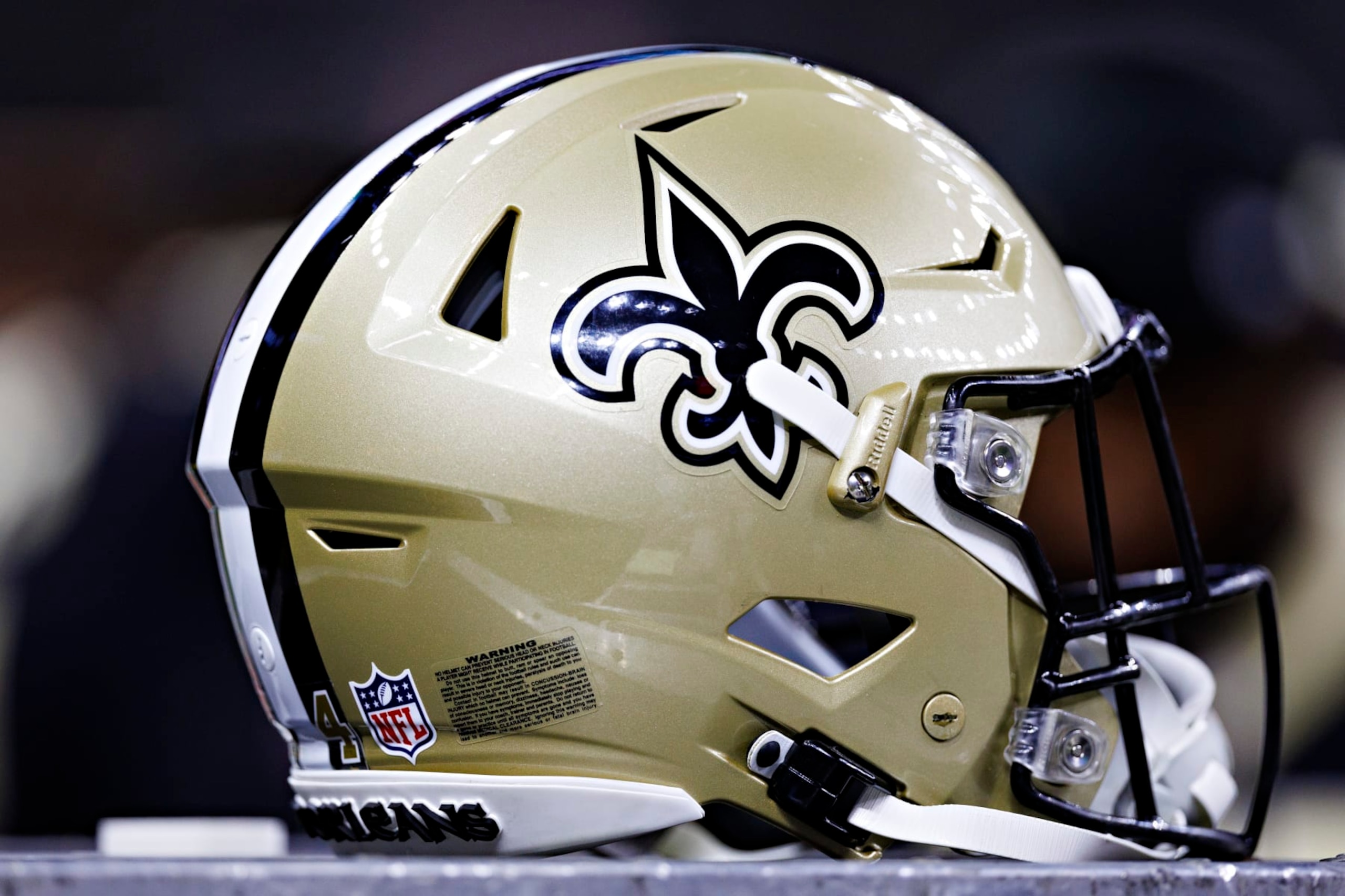NEW ORLEANS, LOUISIANA - AUGUST 27: Helmet of the New Orleans Saints on the sidelines during the preseason game against the Houston Texans at Caesars Superdome on August 27, 2023 in New Orleans, Louisiana. The Texans defeated the Saints 17-13. (Photo by Wesley Hitt/Getty Images) NEW ORLEANS, LOUISIANA - AUGUST 27: Helmet of the New Orleans Saints on the sidelines during the preseason game against the Houston Texans at Caesars Superdome on August 27, 2023 in New Orleans, Louisiana. The Texans defeated the Saints 17-13. (Photo by Wesley Hitt/Getty Images)