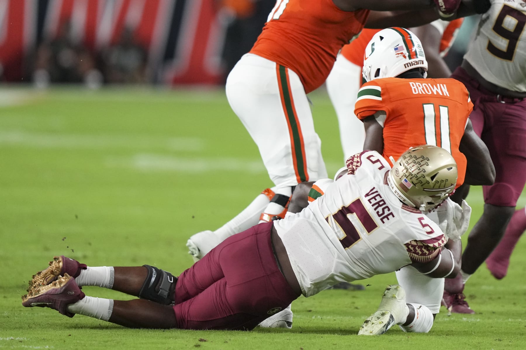 MIAMI GARDENS, FL - NOVEMBER 05: Jared Verse #5 of the Florida State Seminoles sacks Jacurri Brown #11 of the Miami Hurricanes during the second quarter at Hard Rock Stadium on November 5, 2022 in Miami Gardens, Florida. (Photo by Eric Espada/Getty Images)