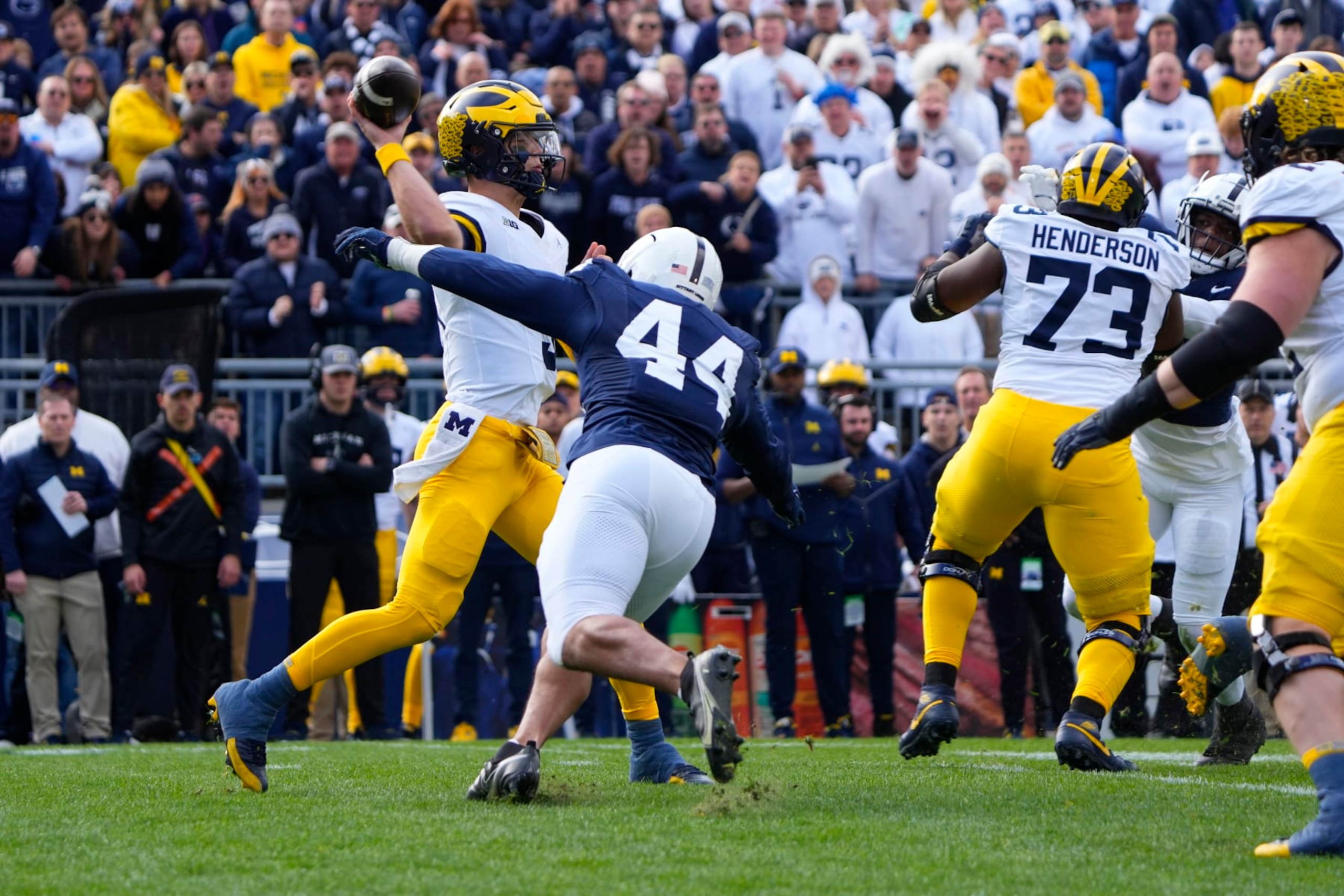 UNIVERSITY PARK, PA - NOVEMBER 11: Michigan Wolverines Quarterback J.J. McCarthy (9) throws the ball with Penn State Nittany Lions Defensive End Chop Robinson (44) applying pressure during the first half of the College Football game between the Michigan Wolverines and the Penn State Nittany Lions on November 11, 2023, at Beaver Stadium in University Park, PA. (Photo by Gregory Fisher/Icon Sportswire via Getty Images) UNIVERSITY PARK, PA - NOVEMBER 11: Michigan Wolverines Quarterback J.J. McCarthy (9) throws the ball with Penn State Nittany Lions Defensive End Chop Robinson (44) applying pressure during the first half of the College Football game between the Michigan Wolverines and the Penn State Nittany Lions on November 11, 2023, at Beaver Stadium in University Park, PA. (Photo by Gregory Fisher/Icon Sportswire via Getty Images)