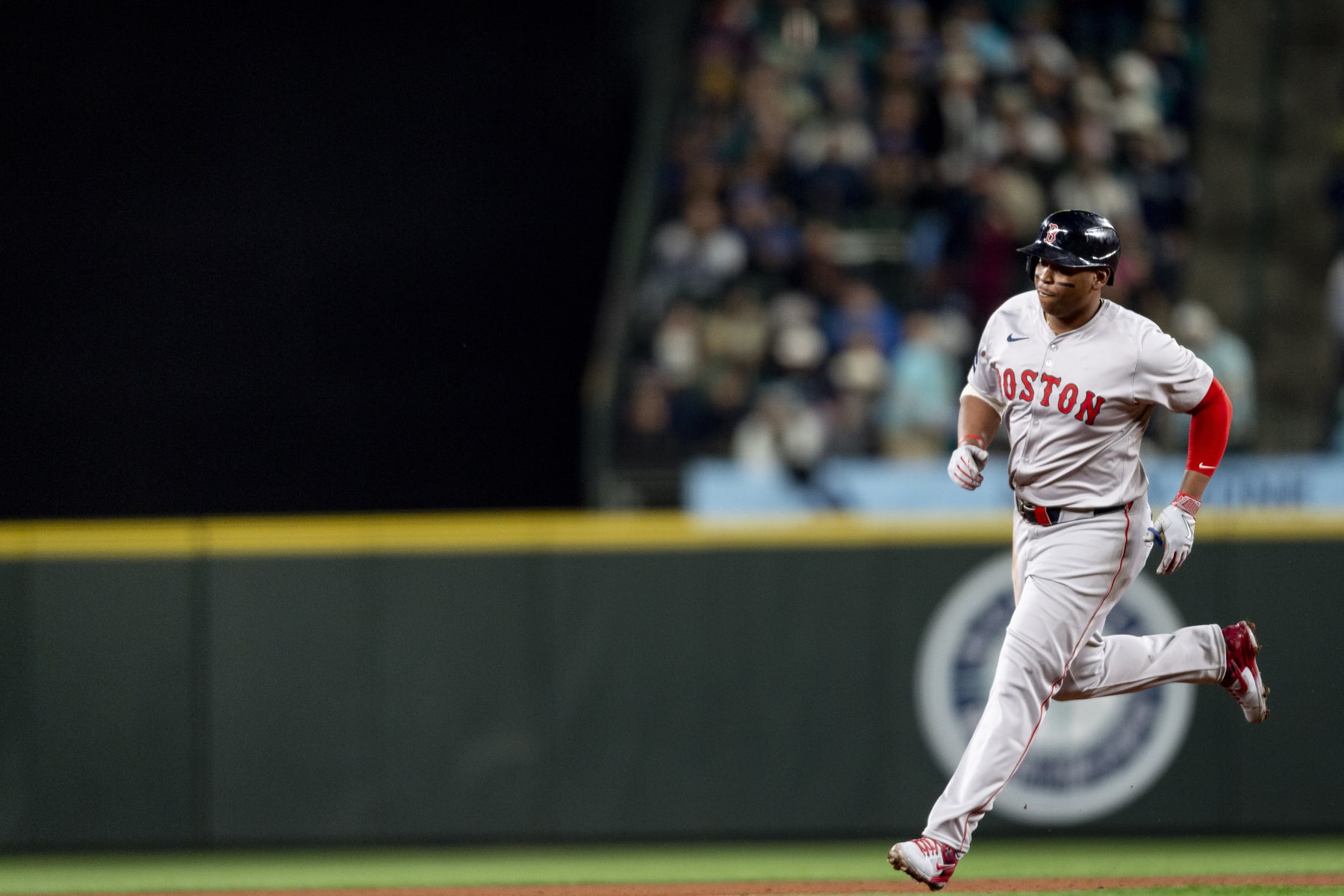 SEATTLE, WASHINGTON - MARCH 28: Rafael Devers #11 of the Boston Red Sox rounds the bases after hitting a two-run home run during the third inning of the 2024 Opening Day game against the Seattle Mariners at T-Mobile Park on March 28, 2024 in Seattle, Washington. (Photo by Maddie Malhotra/Boston Red Sox/Getty Images)