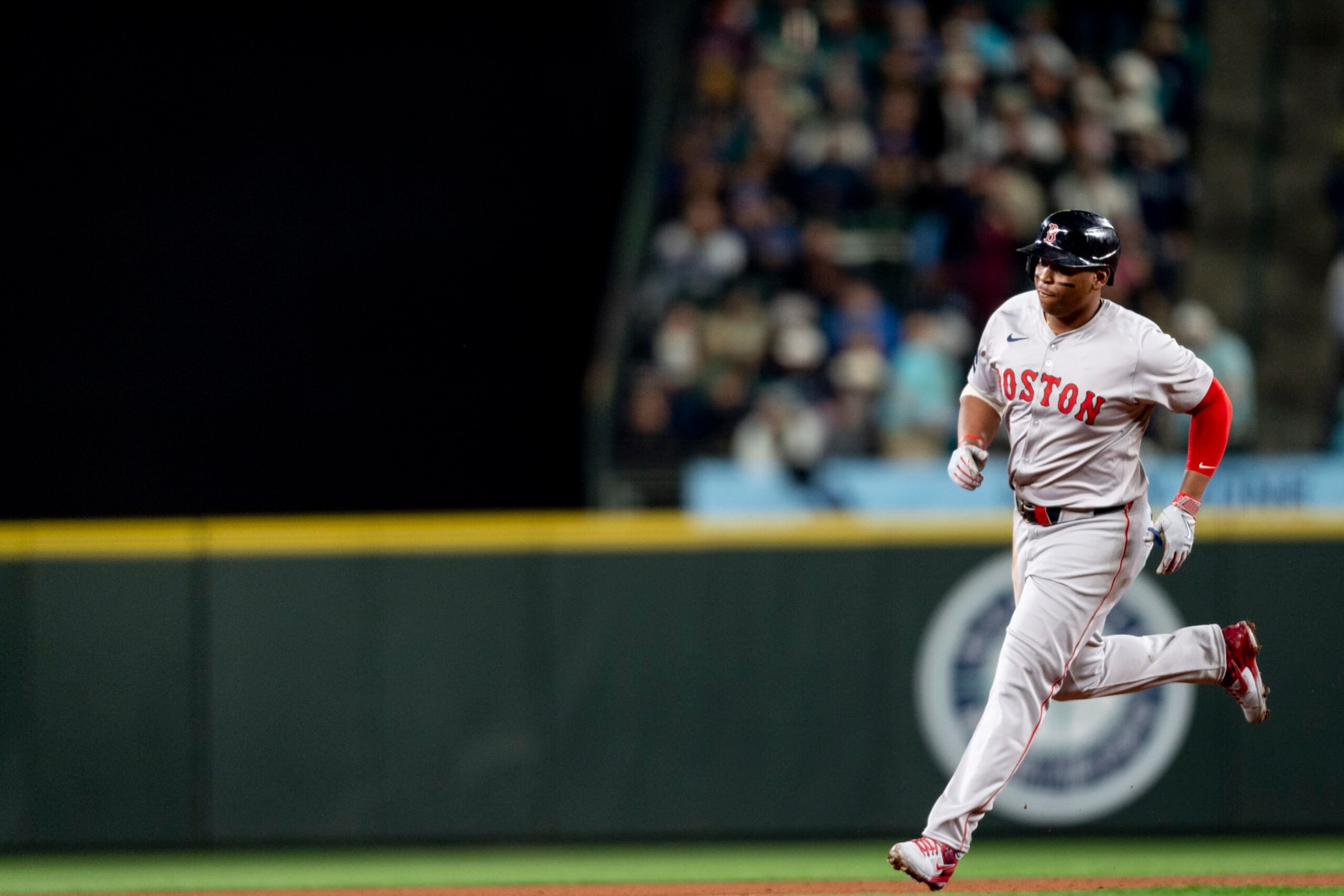 SEATTLE, WASHINGTON - MARCH 28: Rafael Devers #11 of the Boston Red Sox rounds the bases after hitting a two-run home run during the third inning of the 2024 Opening Day game against the Seattle Mariners at T-Mobile Park on March 28, 2024 in Seattle, Washington. (Photo by Maddie Malhotra/Boston Red Sox/Getty Images)