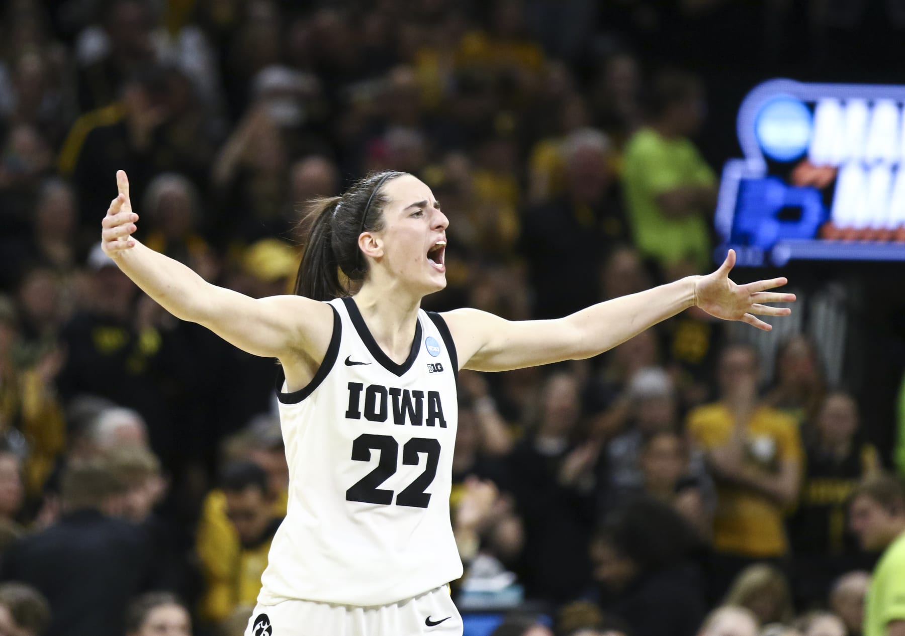 IOWA CITY, IOWA- MARCH 25:  Guard Caitlin Clark #22 of the Iowa Hawkeyes celebrates after drawing a foul late in the second half against the West Virginia Mountaineers during their second round match-up in the 2024 NCAA Division 1 Womens Basketball Championship at Carver-Hawkeye Arena on March 25, 2024 in Iowa City, Iowa.  (Photo by Matthew Holst/Getty Images)