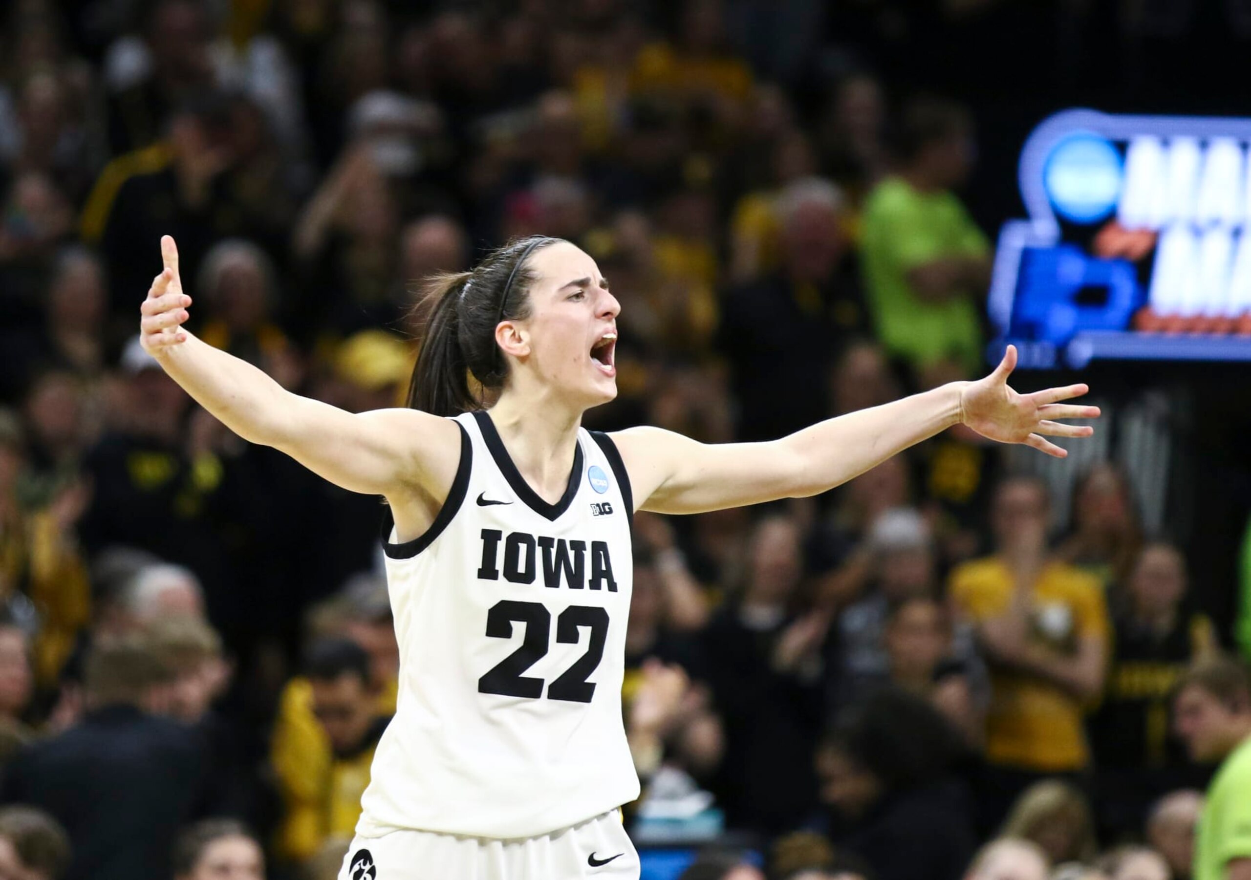 IOWA CITY, IOWA- MARCH 25:  Guard Caitlin Clark #22 of the Iowa Hawkeyes celebrates after drawing a foul late in the second half against the West Virginia Mountaineers during their second round match-up in the 2024 NCAA Division 1 Womens Basketball Championship at Carver-Hawkeye Arena on March 25, 2024 in Iowa City, Iowa.  (Photo by Matthew Holst/Getty Images)