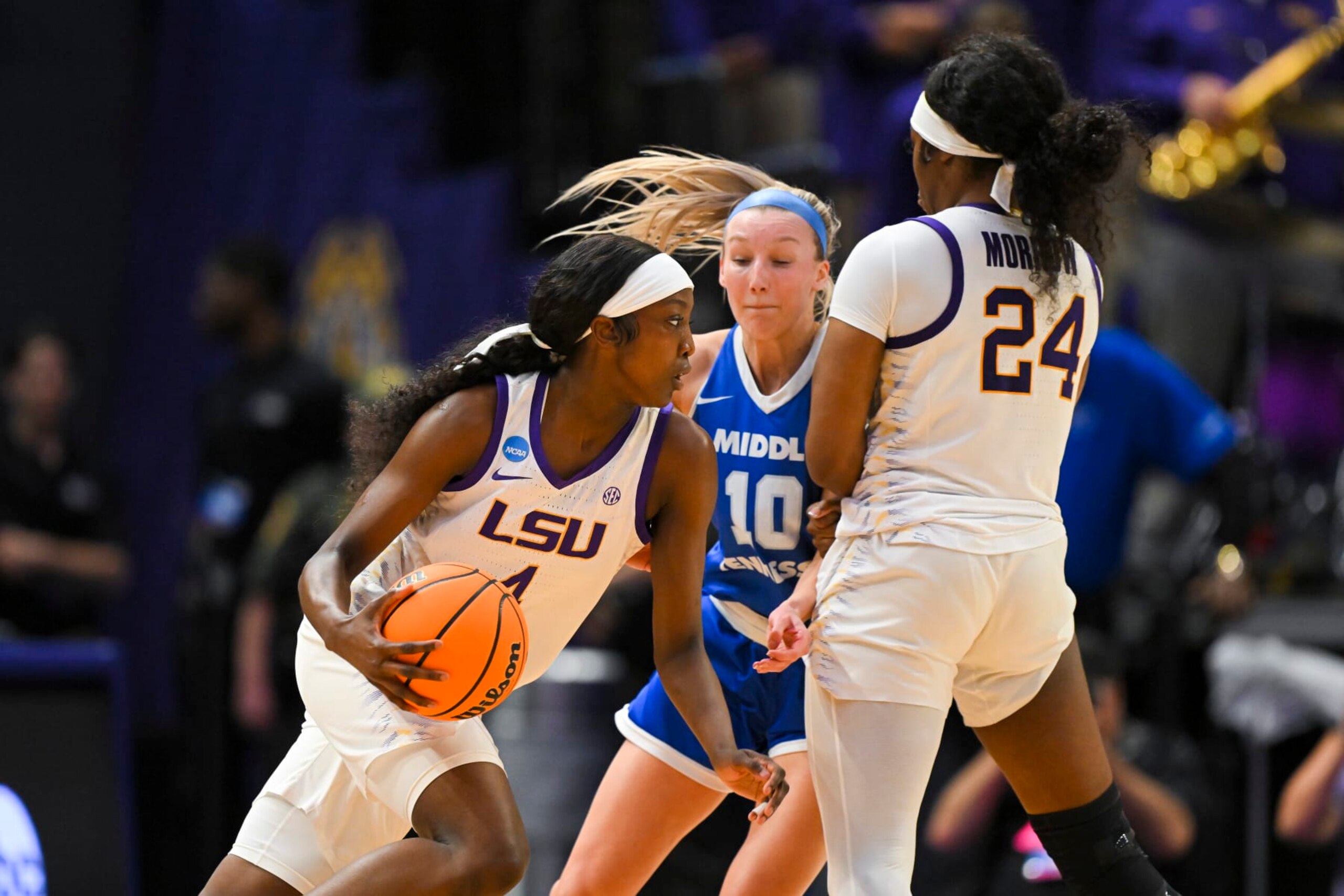 BATON ROUGE, LOUISIANA - MARCH 24: Flau'jae Johnson #4 of the LSU Tigers dribbles past Jalynn Gregory #10 of the Middle Tennessee Blue Raiders as Aneesah Morrow #24 of the LSU Tigers sets a screen during the third quarter during the second round of the 2024 NCAA Women's Basketball Tournament held at Pete Maravich Assembly Center on March 24, 2024 in Baton Rouge, Louisiana. (Photo by Andy Hancock/NCAA Photos/NCAA Photos via Getty Images)