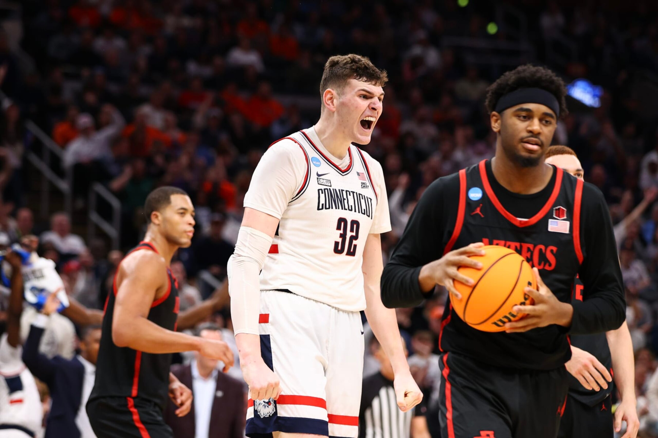 BOSTON, MASSACHUSETTS - MARCH 28: Donovan Clingan #32 of the Connecticut Huskies celebrates a dunk against the San Diego State Aztecs during the Sweet Sixteen round of the 2024 NCAA Men's Basketball Tournament held at TD Garden on March 28, 2024 in Boston, Massachusetts. (Photo by Jamie Schwaberow/NCAA Photos via Getty Images)