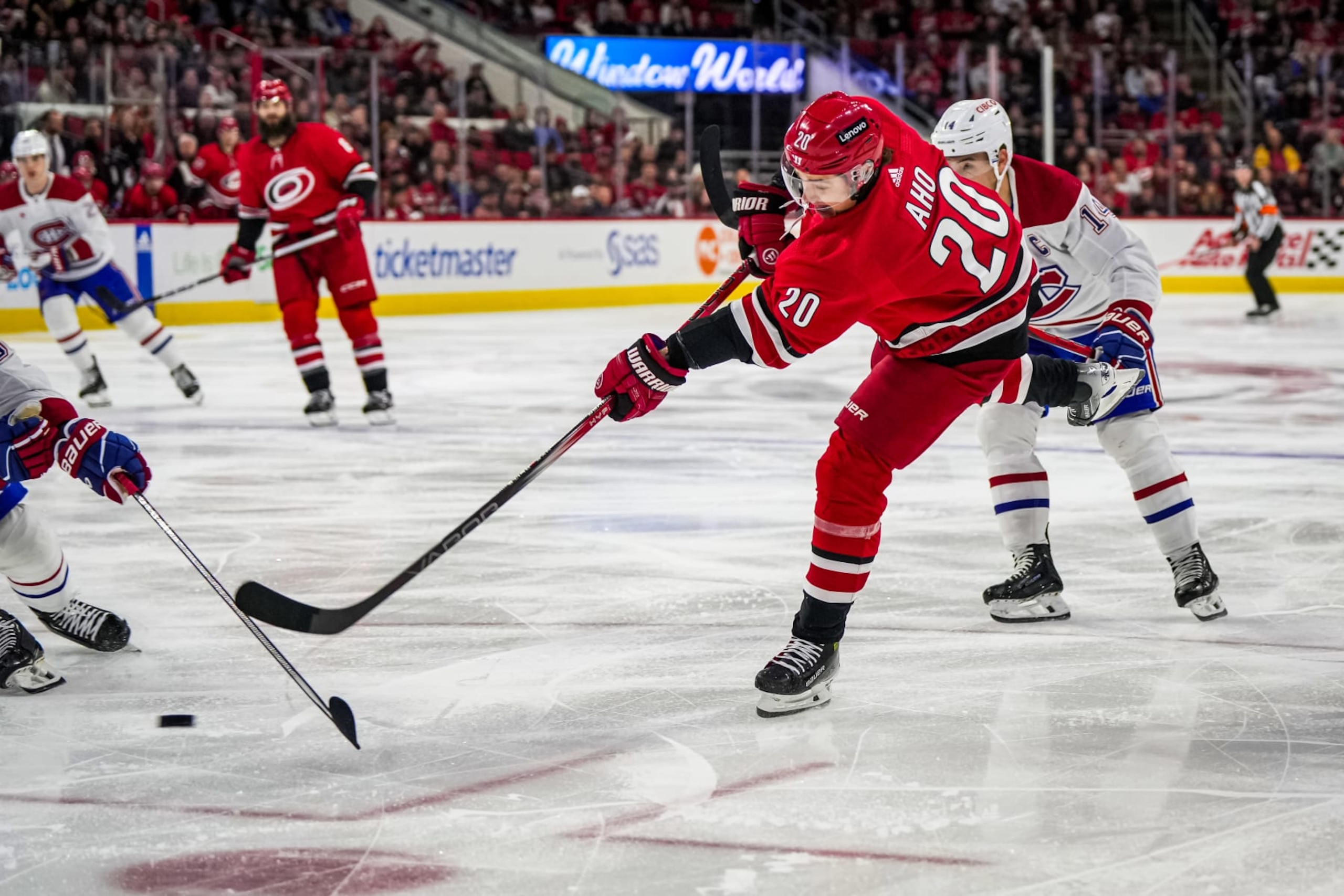 RALEIGH, NORTH CAROLINA - DECEMBER 28: Sebastian Aho #20 of the Carolina Hurricanes shoots the puck during the first period against the Montreal Canadiens at PNC Arena on December 28, 2023 in Raleigh, North Carolina. (Photo by Josh Lavallee/NHLI via Getty Images)