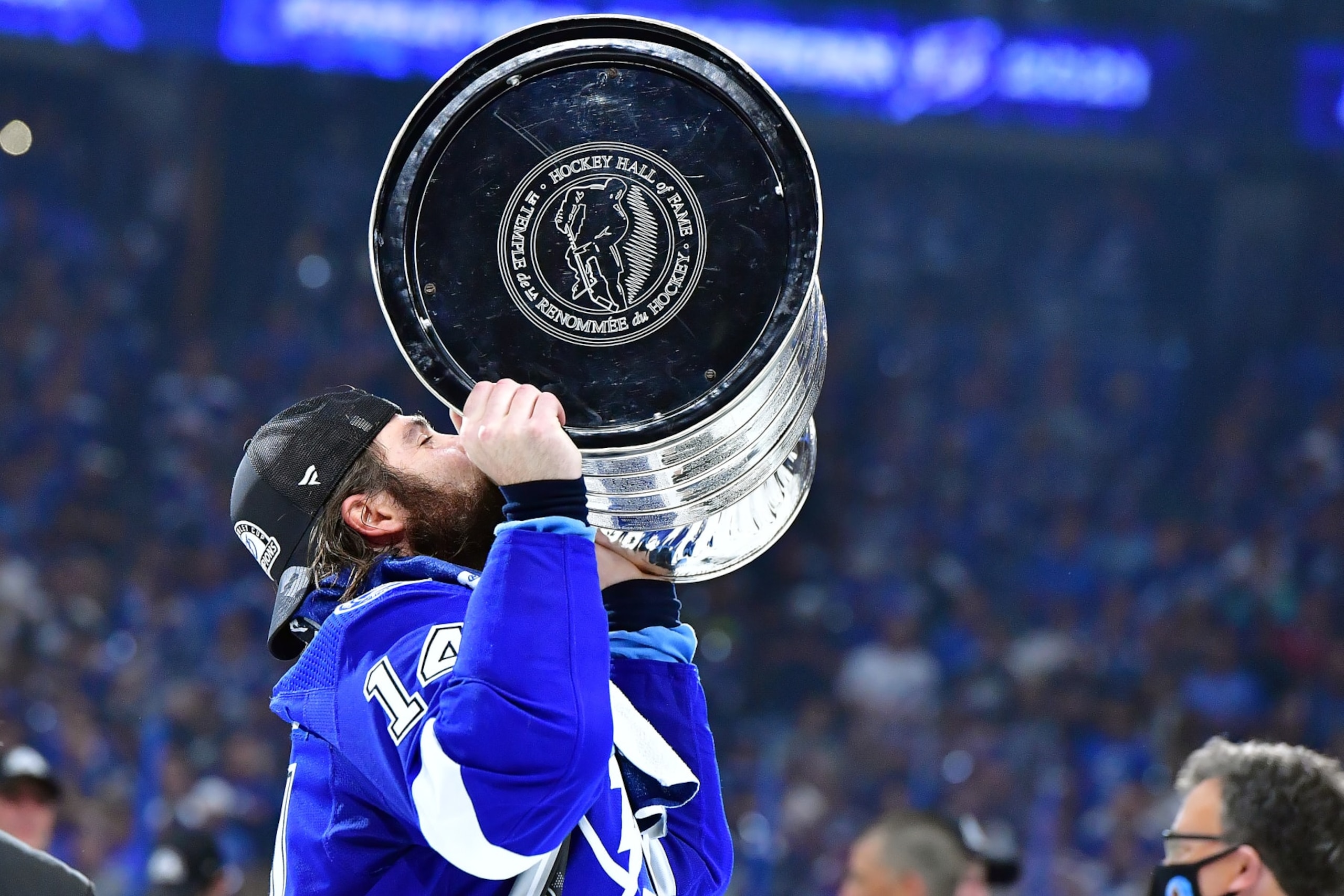 TAMPA, FLORIDA - JULY 07:  Pat Maroon #14 of the Tampa Bay Lightning hoists the Stanley Cup after the 1-0 victory against the Montreal Canadiens in Game Five to win the 2021 NHL Stanley Cup Final at Amalie Arena on July 07, 2021 in Tampa, Florida. (Photo by Julio Aguilar/Getty Images)