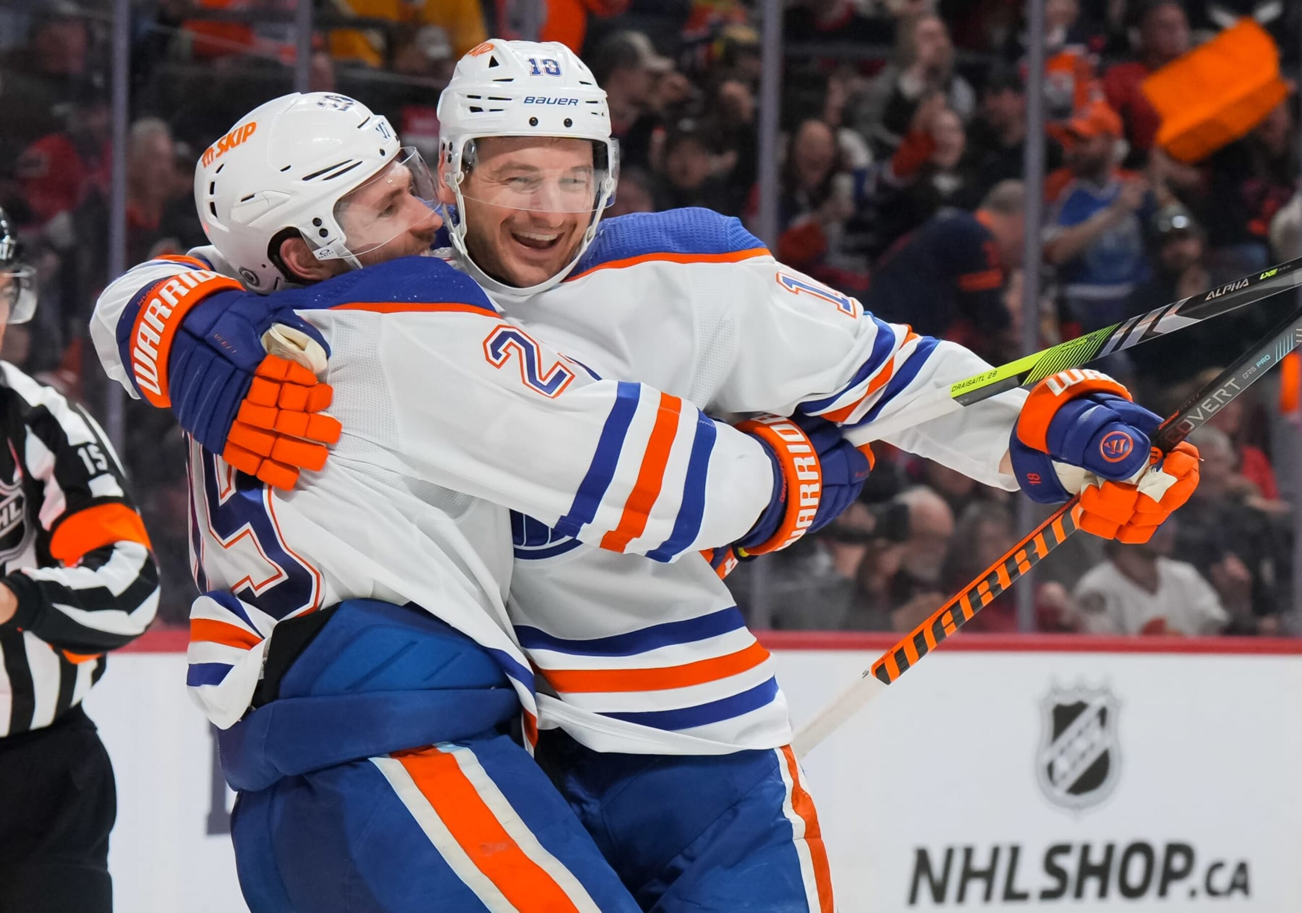 OTTAWA, CANADA - MARCH 24:  Zach Hyman #18 of the Edmonton Oilers celebrates his second period goal against the Ottawa Senators, his 50th of the season, with teammate Leon Draisaitl #29 at Canadian Tire Centre on March 24, 2024 in Ottawa, Ontario, Canada.  (Photo by André Ringuette/NHLI via Getty Images)