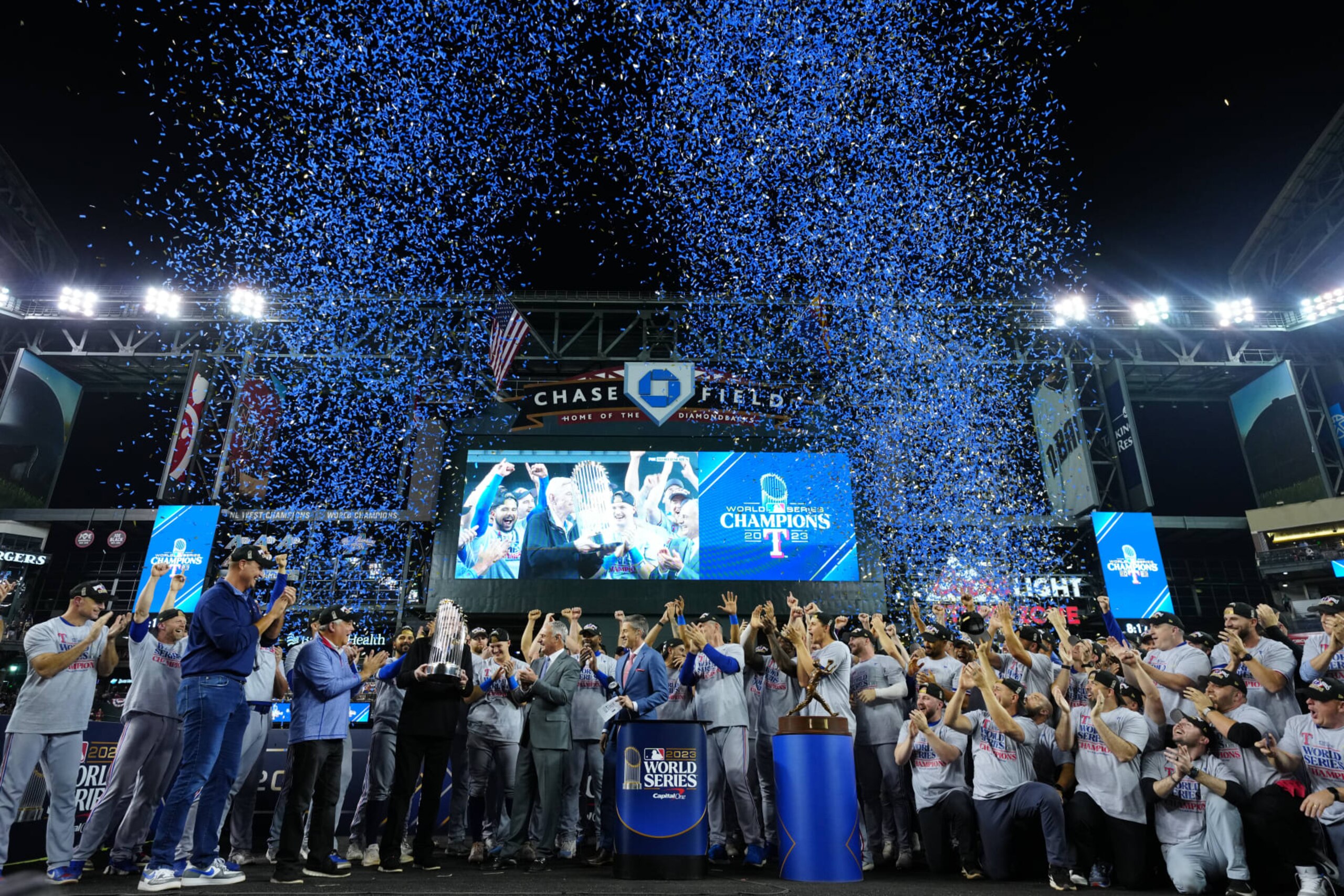 PHOENIX, AZ - NOVEMBER 01: Members of the Texas Rangers celebrate during the trophy presentation after Game 5 of the 2023 World Series between the Texas Rangers and the Arizona Diamondbacks at Chase Field on Wednesday, November 1, 2023 in Phoenix, Arizona. (Photo by Daniel Shirey/MLB Photos via Getty Images)