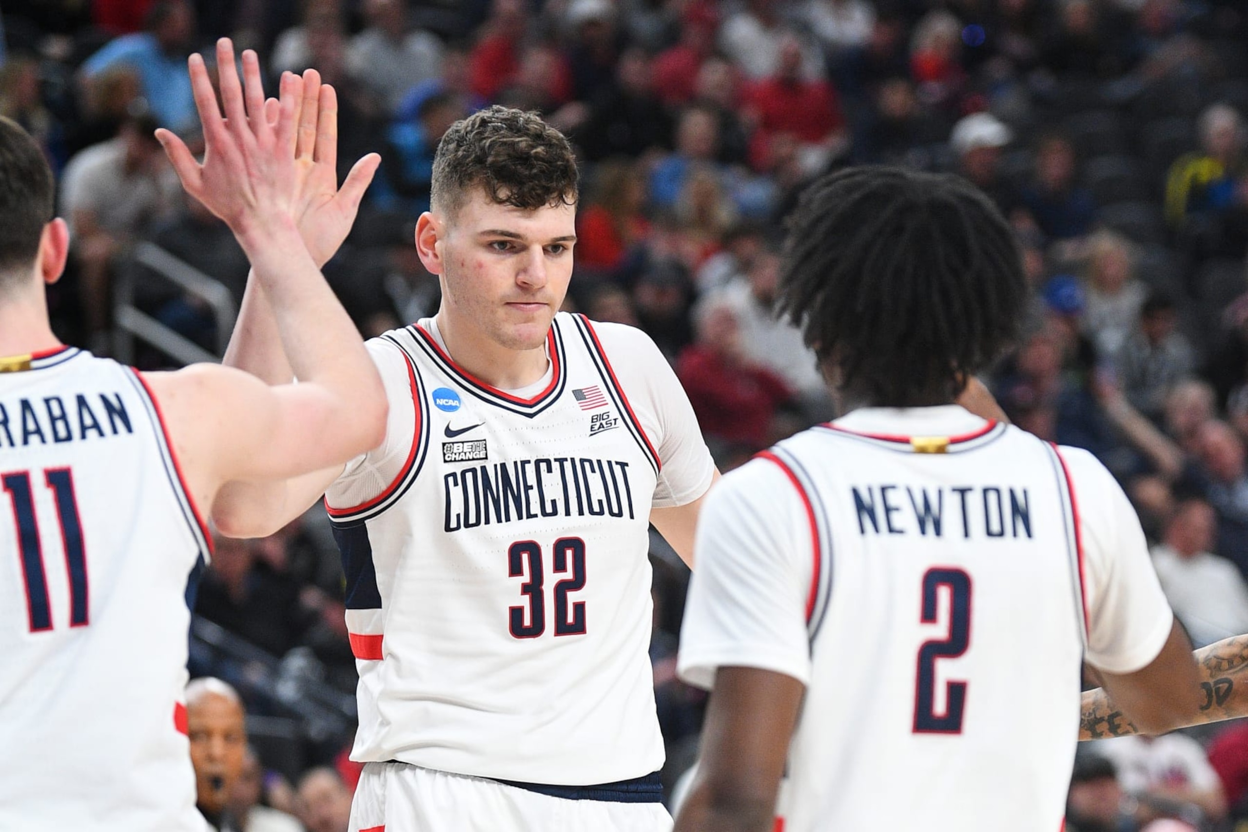 LAS VEGAS, NV - MARCH 24: UConn Huskies center Donovan Clingan (32) gets a high five from UConn Huskies forward Alex Karaban (11) and UConn Huskies guard Tristen Newton (2) during the NCAA Division I Men's Championship Sweet Sixteen round basketball game between the Arkansas Razorbacks and the UConn Huskies on March 24, 2023 at T-Mobile Arena in Las Vegas, NV. (Photo by Brian Rothmuller/Icon Sportswire via Getty Images) LAS VEGAS, NV - MARCH 24: UConn Huskies center Donovan Clingan (32) gets a high five from UConn Huskies forward Alex Karaban (11) and UConn Huskies guard Tristen Newton (2) during the NCAA Division I Men's Championship Sweet Sixteen round basketball game between the Arkansas Razorbacks and the UConn Huskies on March 24, 2023 at T-Mobile Arena in Las Vegas, NV. (Photo by Brian Rothmuller/Icon Sportswire via Getty Images)