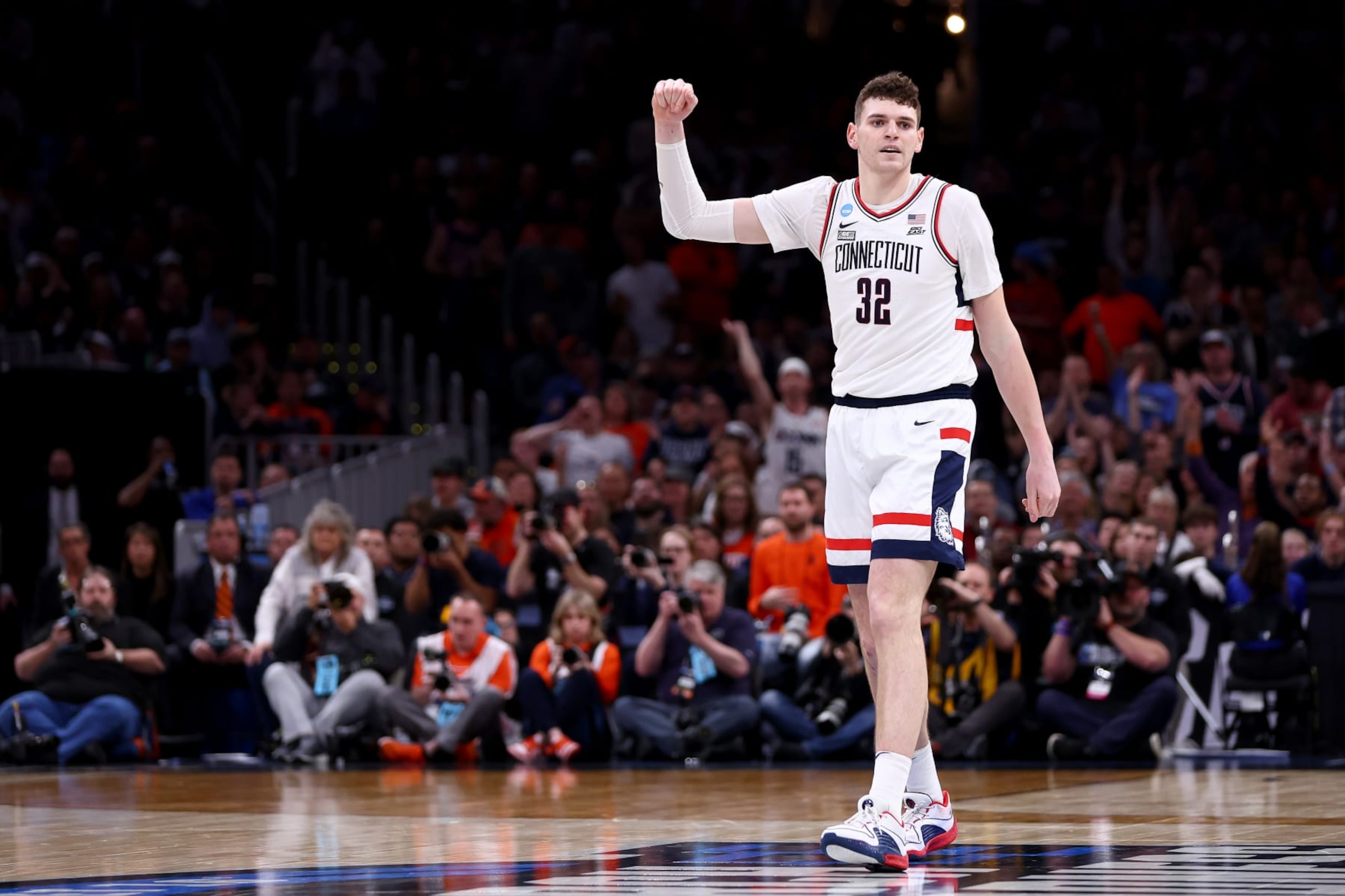 BOSTON, MASSACHUSETTS - MARCH 30: Donovan Clingan #32 of the Connecticut Huskies celebrates a basket against the Illinois Fighting Illini during the second half in the Elite 8 round of the NCAA Men's Basketball Tournament at TD Garden on March 30, 2024 in Boston, Massachusetts. (Photo by Maddie Meyer/Getty Images)