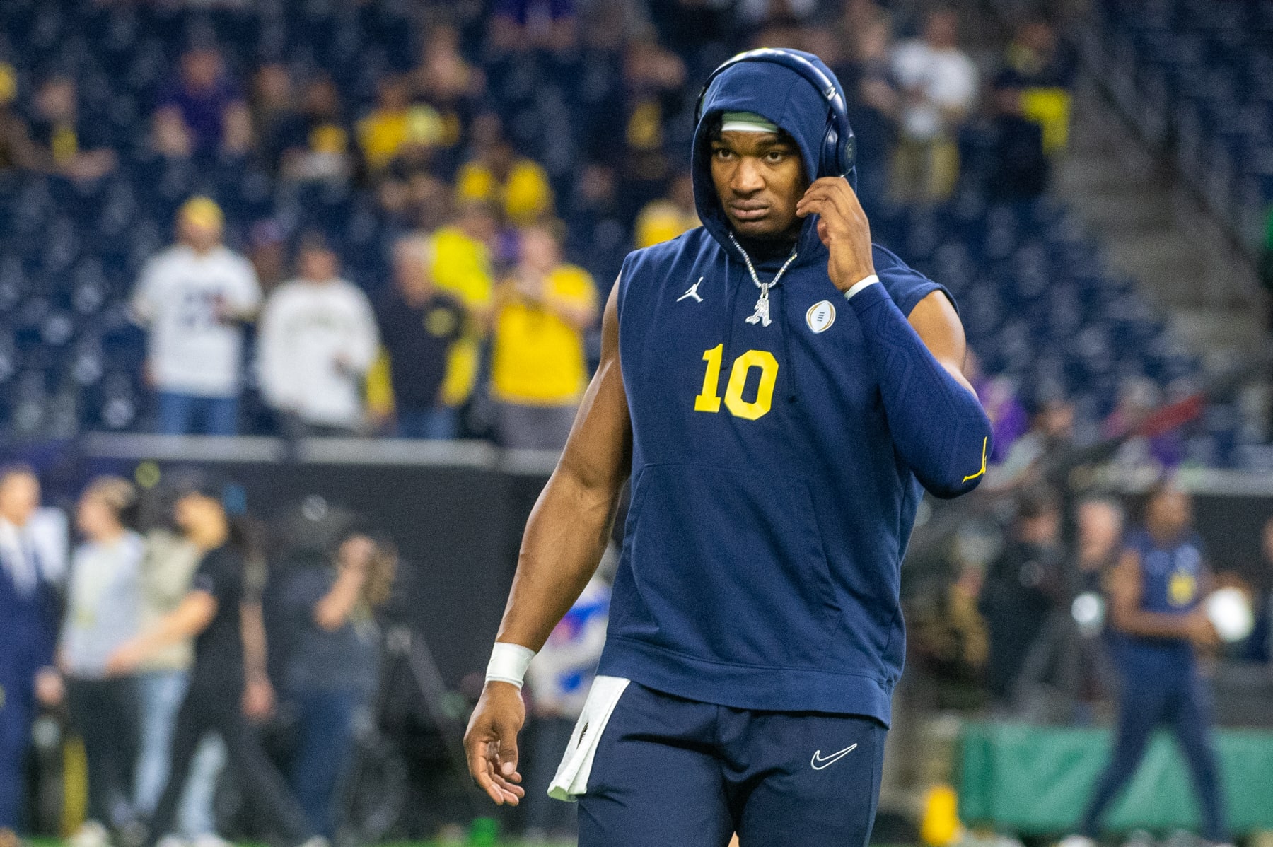 HOUSTON, TEXAS - JANUARY 08: Alex Orji #10 of the Michigan Wolverines warms up before the 2024 CFP National Championship game against the Washington Huskies at NRG Stadium on January 08, 2024 in Houston, Texas. (Photo by Aaron J. Thornton/Getty Images)