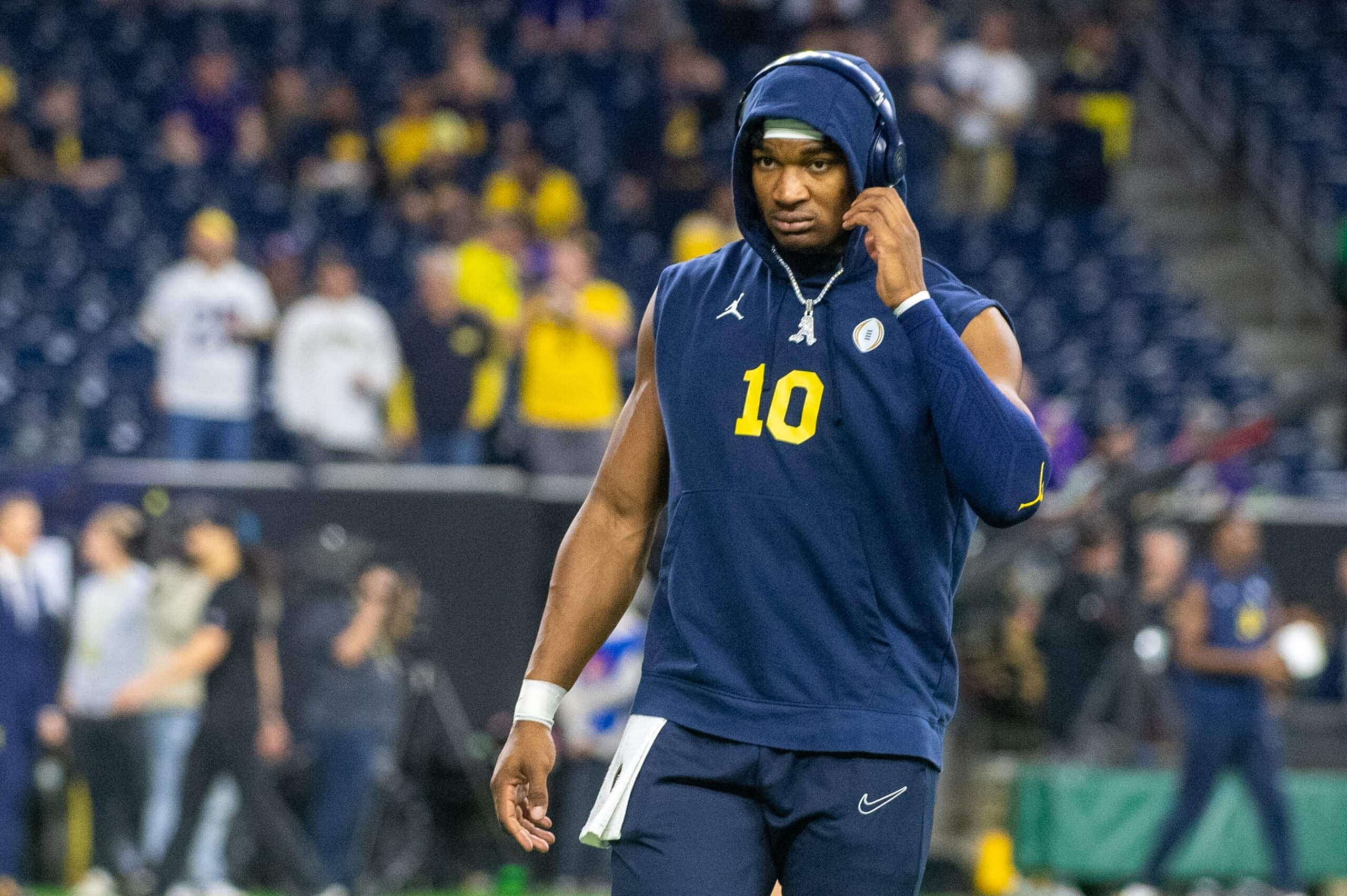 HOUSTON, TEXAS - JANUARY 08: Alex Orji #10 of the Michigan Wolverines warms up before the 2024 CFP National Championship game against the Washington Huskies at NRG Stadium on January 08, 2024 in Houston, Texas. (Photo by Aaron J. Thornton/Getty Images)