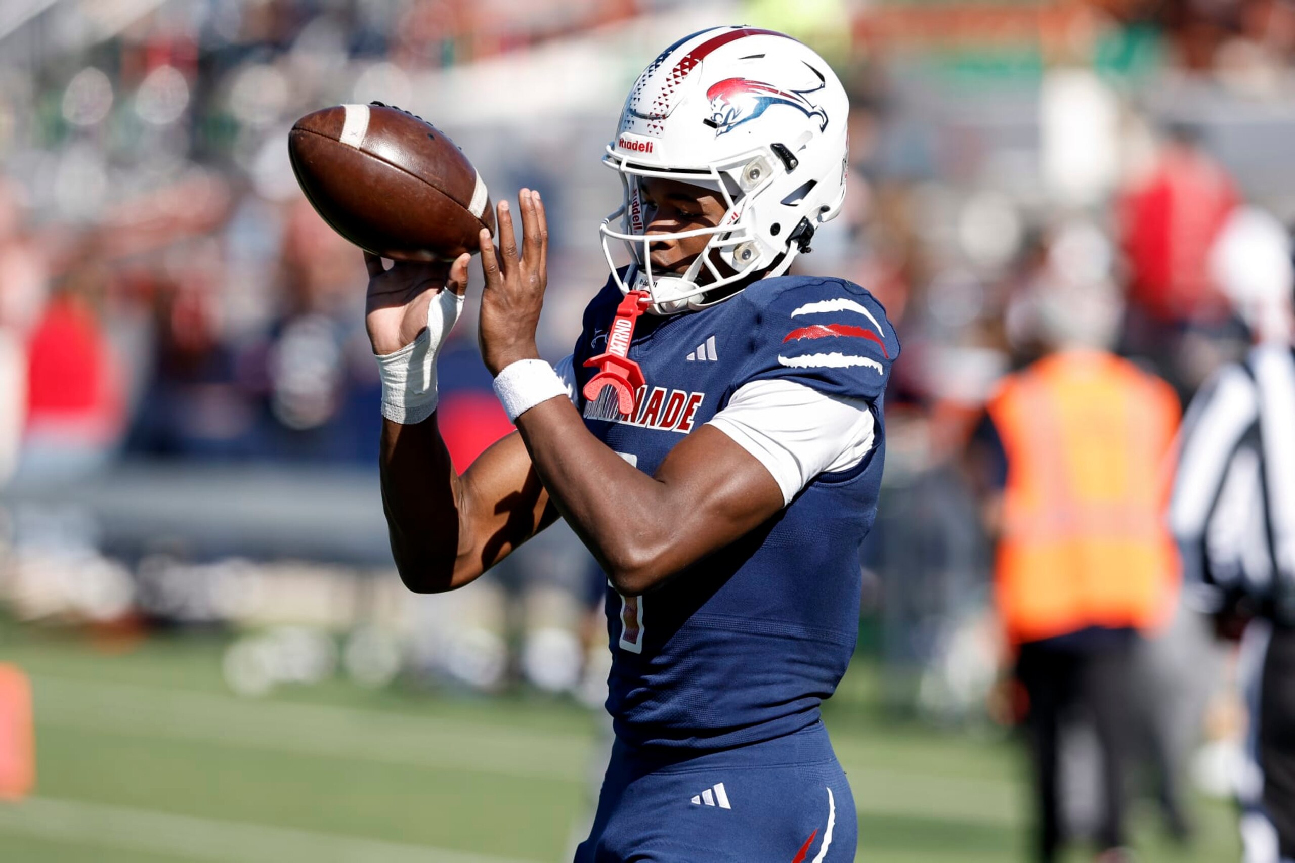 TALLAHASSEE, FLORIDA - DECEMBER 07: Wide Receiver Jeremiah Smith #4 of the Chaminade-Madonna Lions warms up after halftime of the FHSAA Class1M Football State Championship game against the Clearwater Central Catholic Marauders at Bragg Memorial Stadium on Ken Riley Field on the campus of Florida A&M University on December 7, 2023 in Tallahassee, Florida. Smith is a 5-star Wide Receiver recruit and the #1 collegiate prospect in the nation. He has committed to the Ohio State Buckeyes. The Lions defeated the Marauders 56 to 0. (Photo by Don Juan Moore/Getty Images)