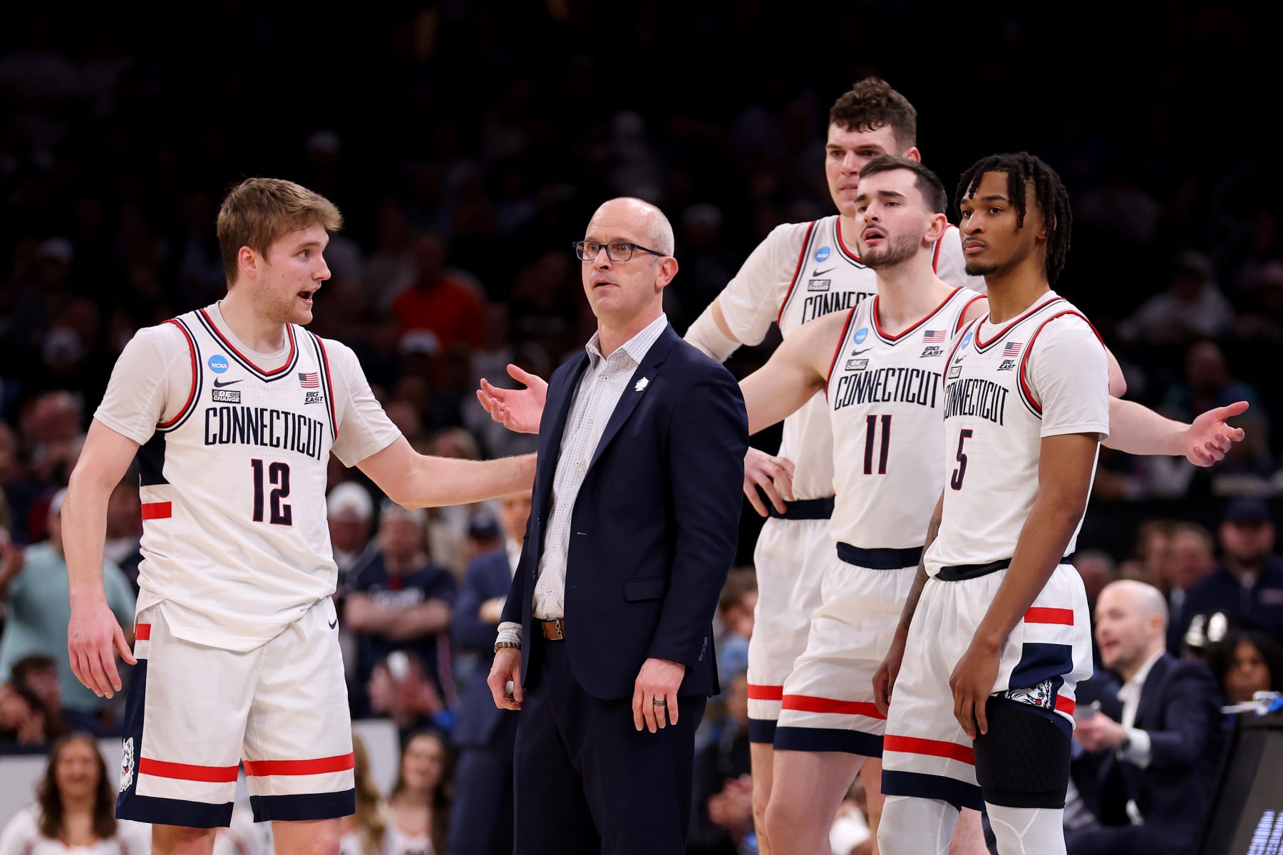 BOSTON, MASSACHUSETTS - MARCH 30: Cam Spencer #12 and head coach Dan Hurley of the Connecticut Huskies react against the Illinois Fighting Illini during the second half in the Elite 8 round of the NCAA Men's Basketball Tournament at TD Garden on March 30, 2024 in Boston, Massachusetts. (Photo by Michael Reaves/Getty Images)
